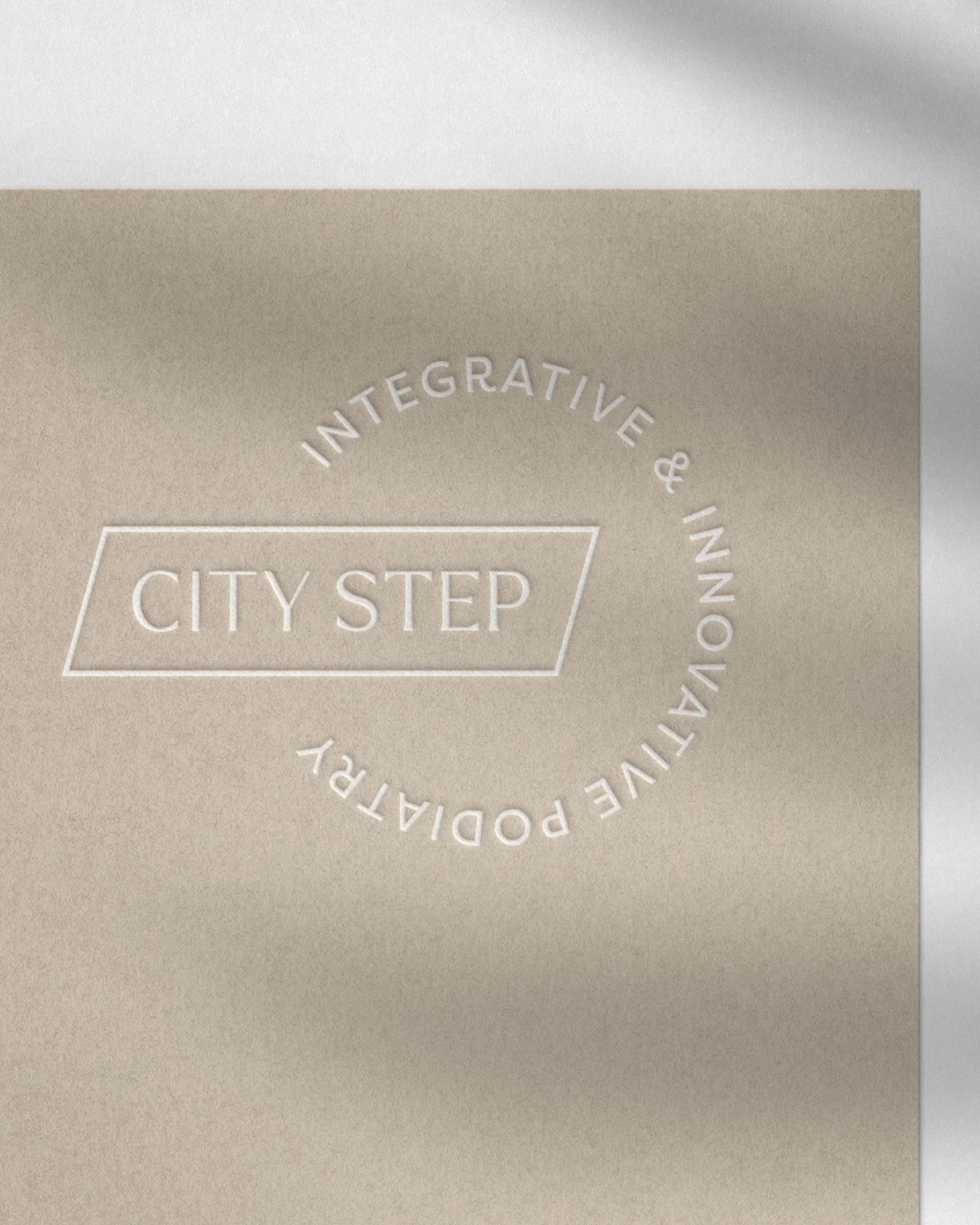 City Step Podiatry logo embossed on stationery