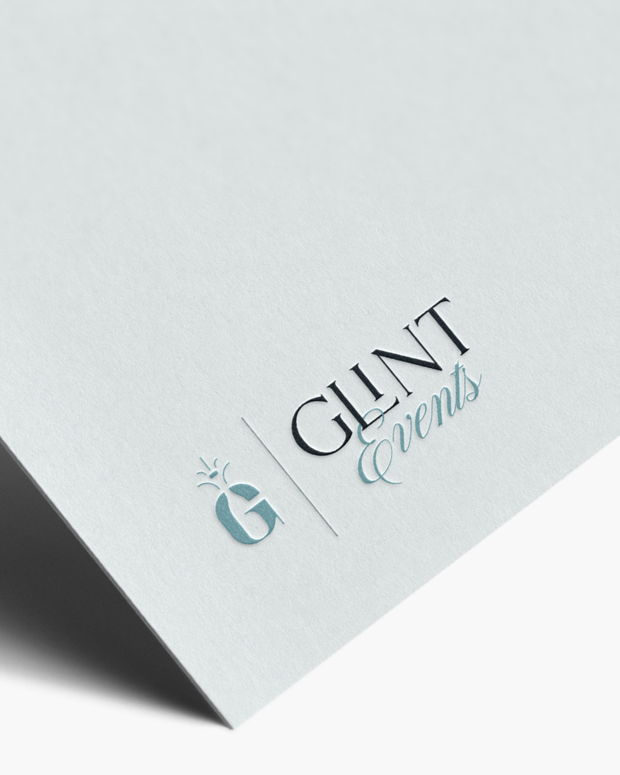 Glint Events logo embossed on card stock