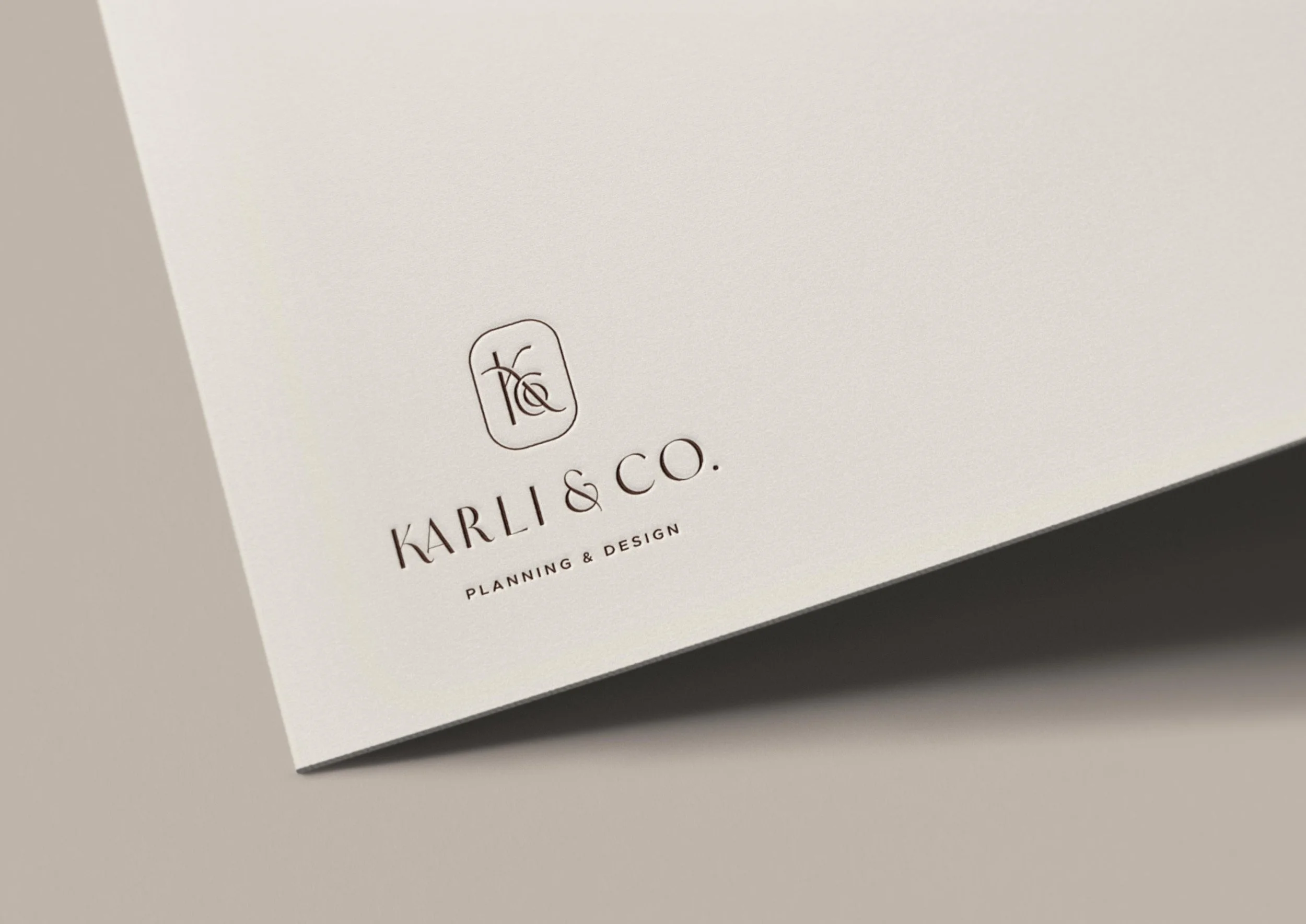 Karli & Co. logo embossed on card stock