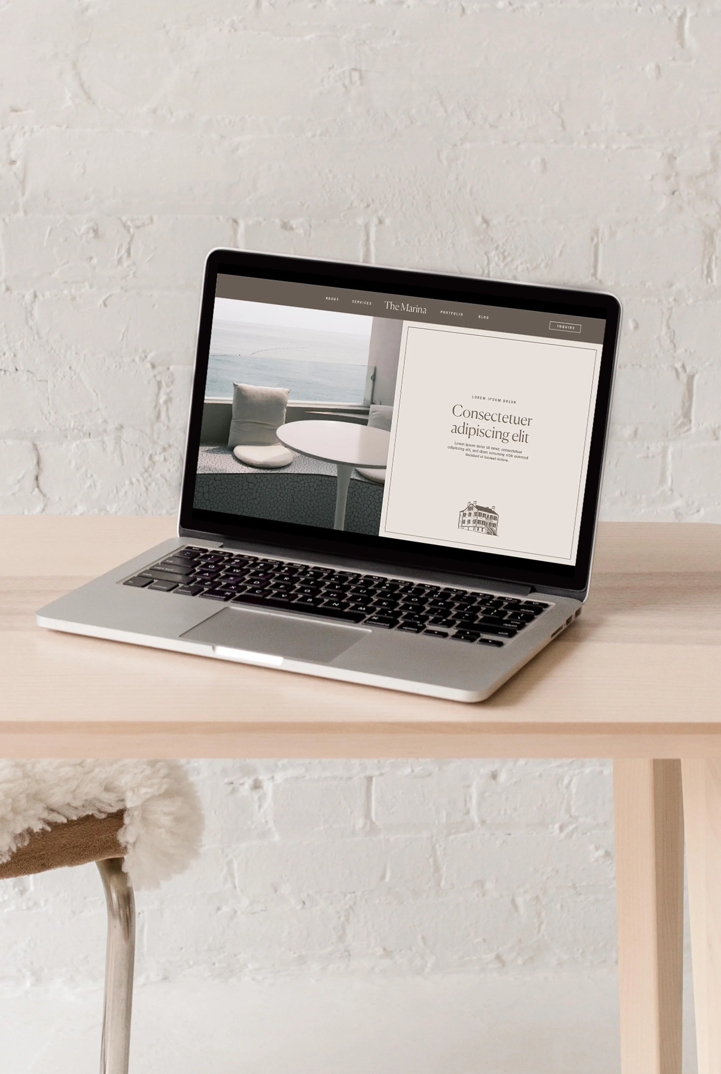 laptop displaying the hero section of The Marina website design