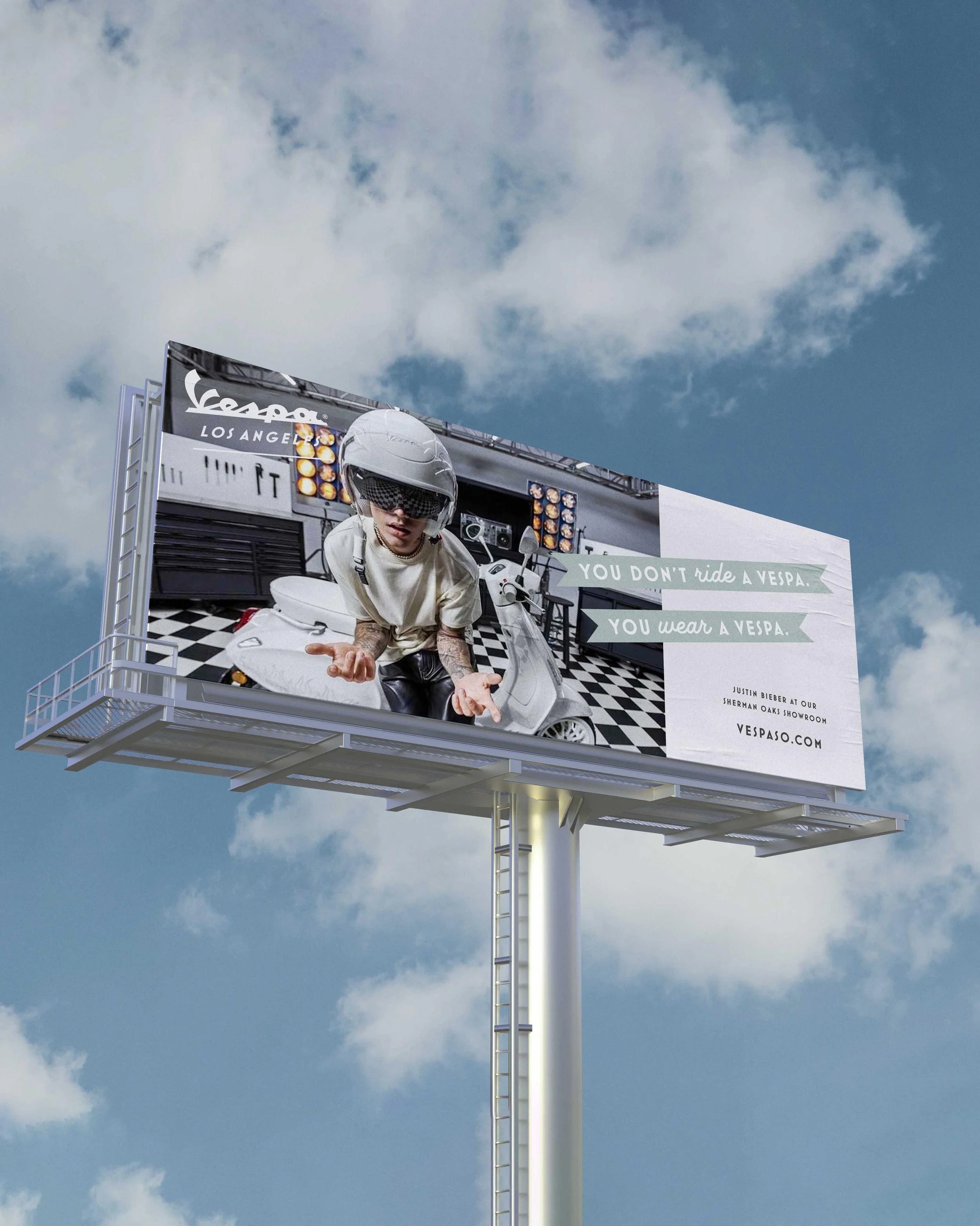 Vespa Los Angeles billboard with headline "You don't ride a Vespa/You wear a Vespa"