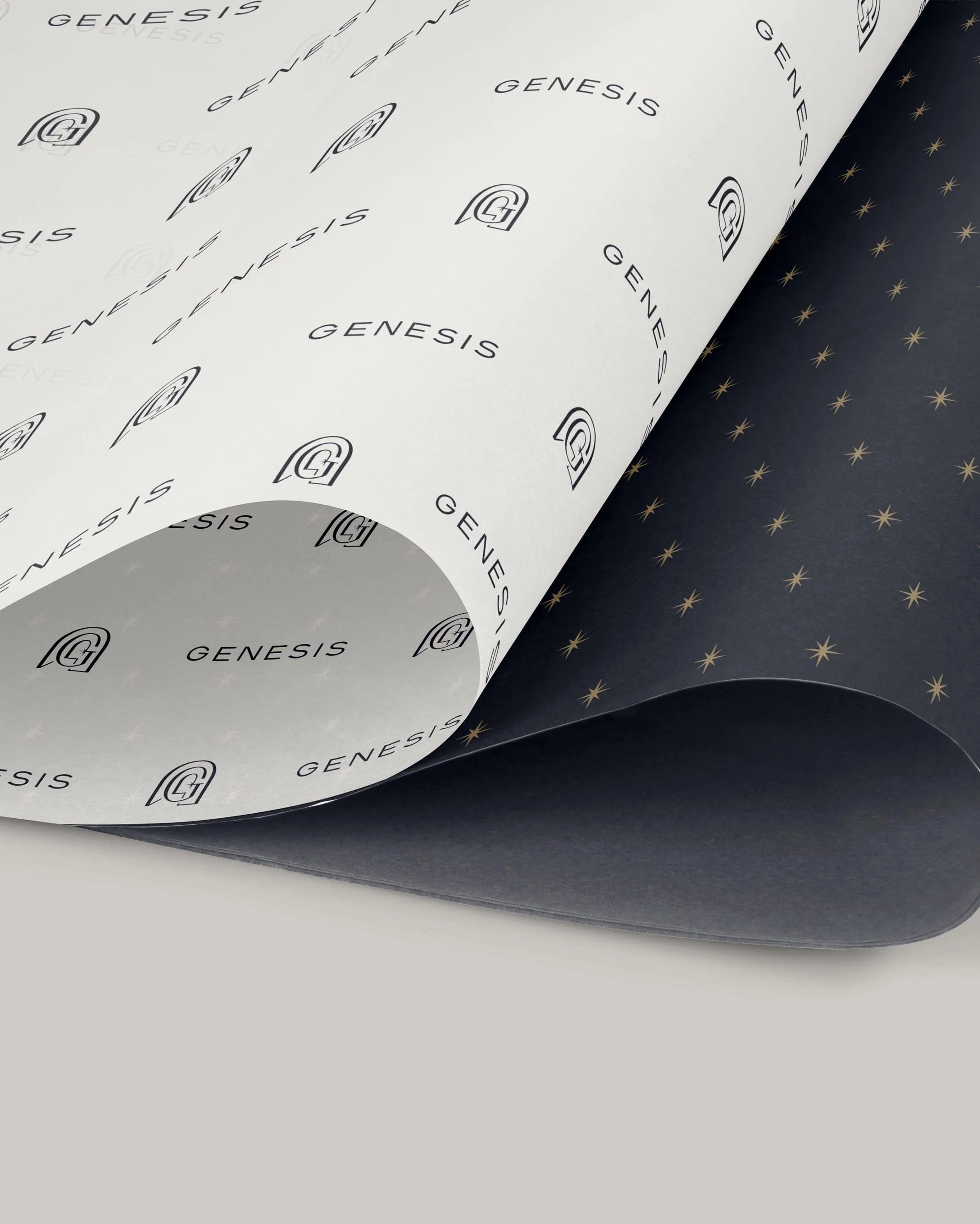 branded tissue paper with Genesis logo and stars
