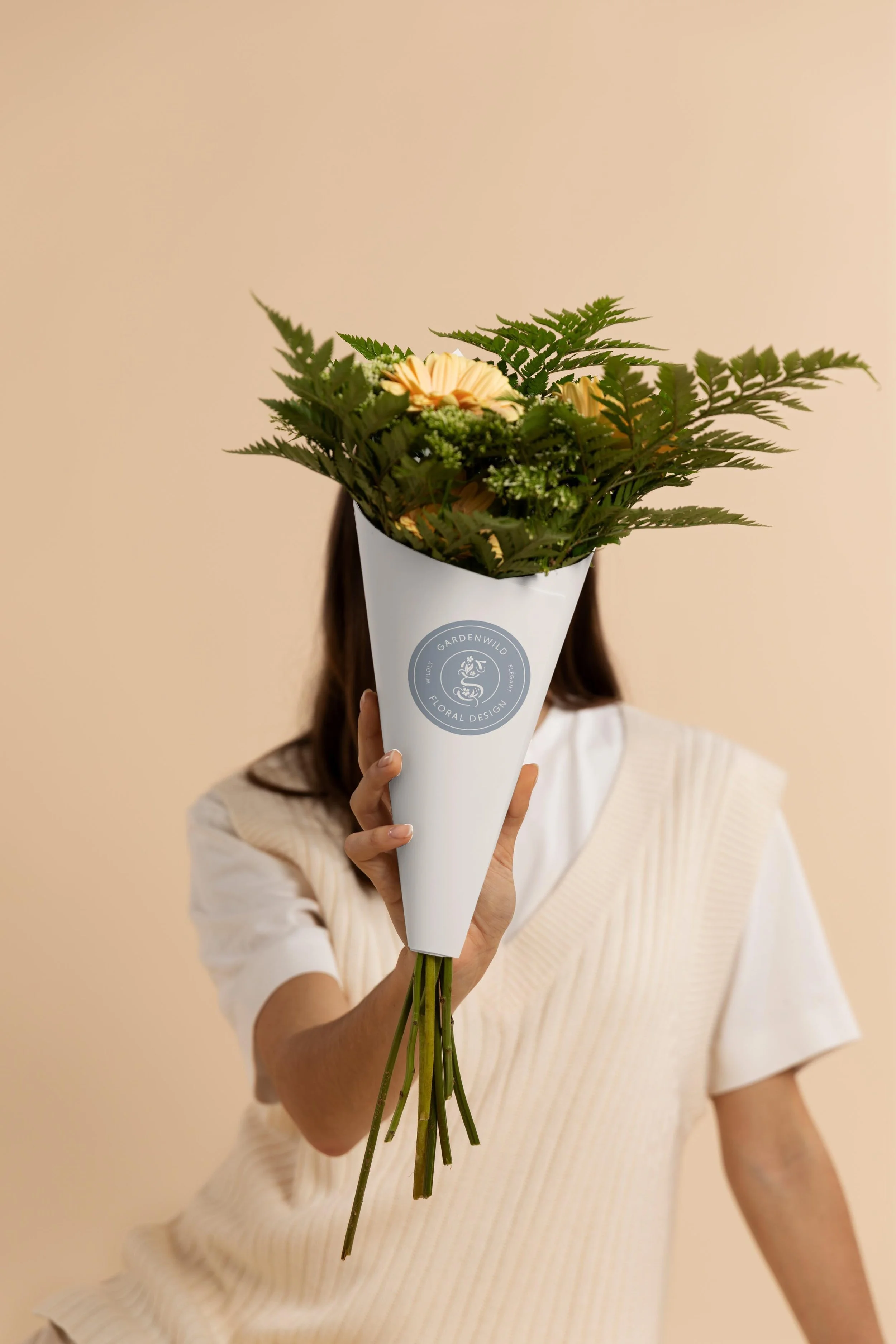 bouquet with a branded Gardenwild sticker on the wrapping paper