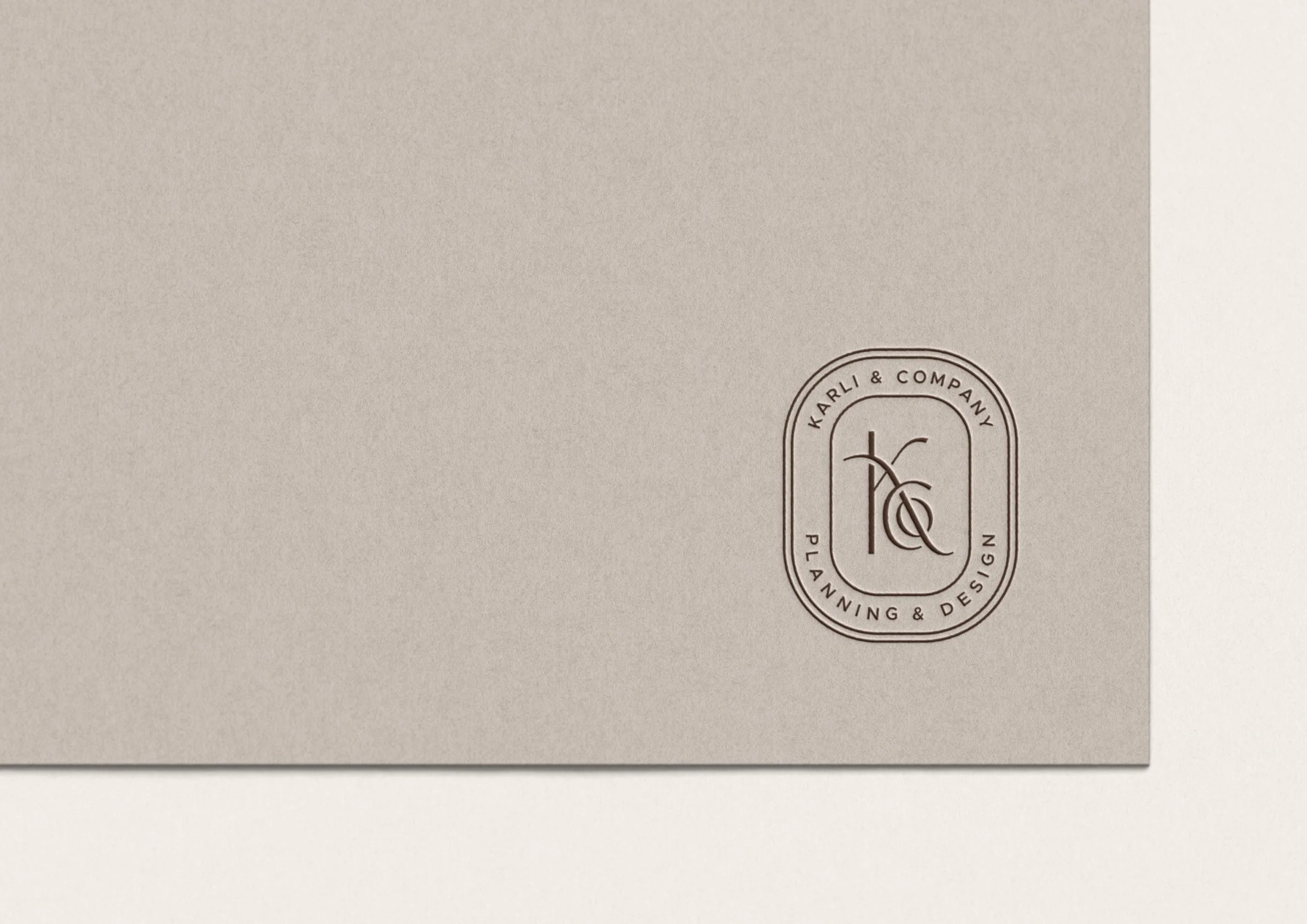 Karli & Co. badge embossed on card stock
