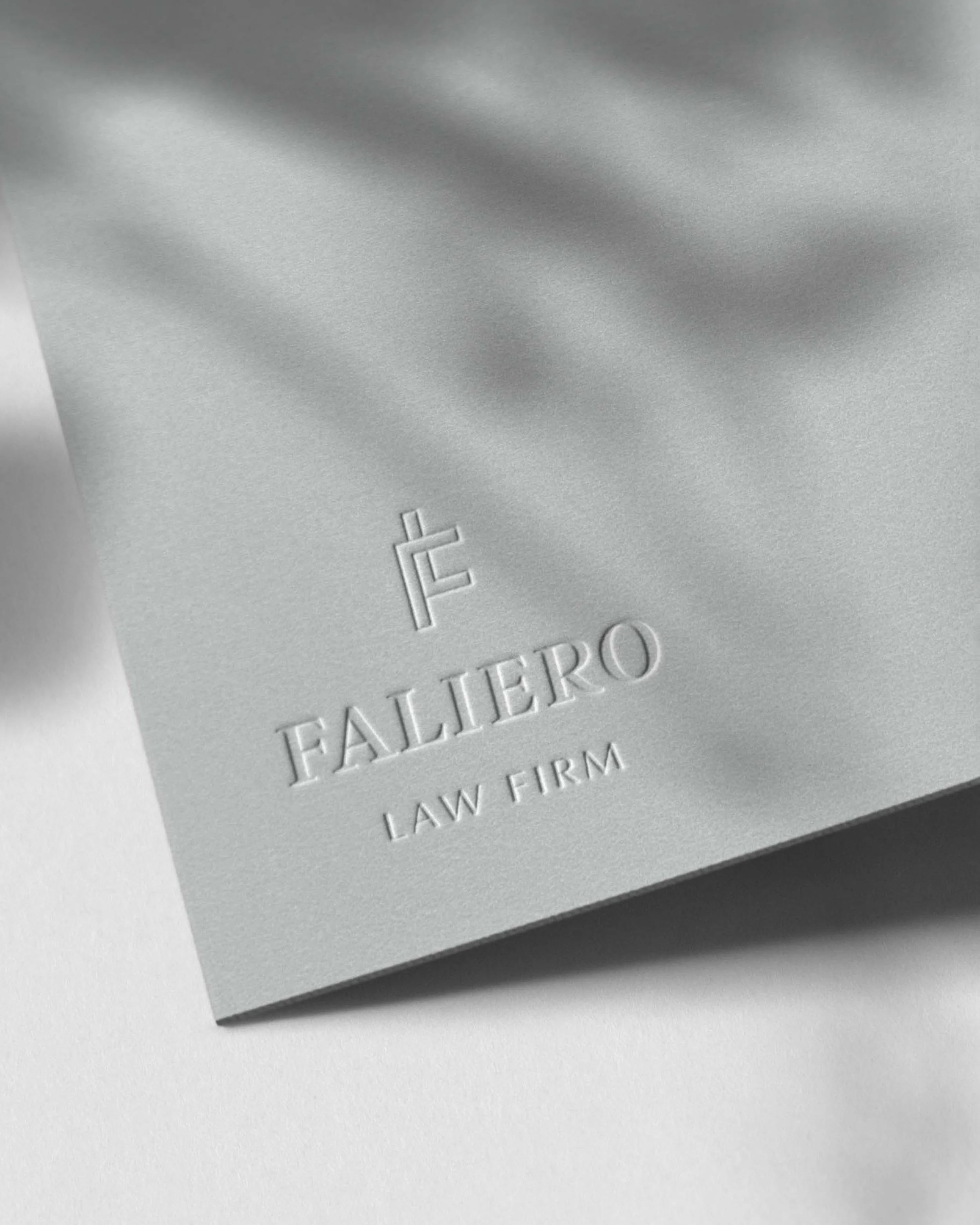 Faliero Law Firm logo embossed on stationery