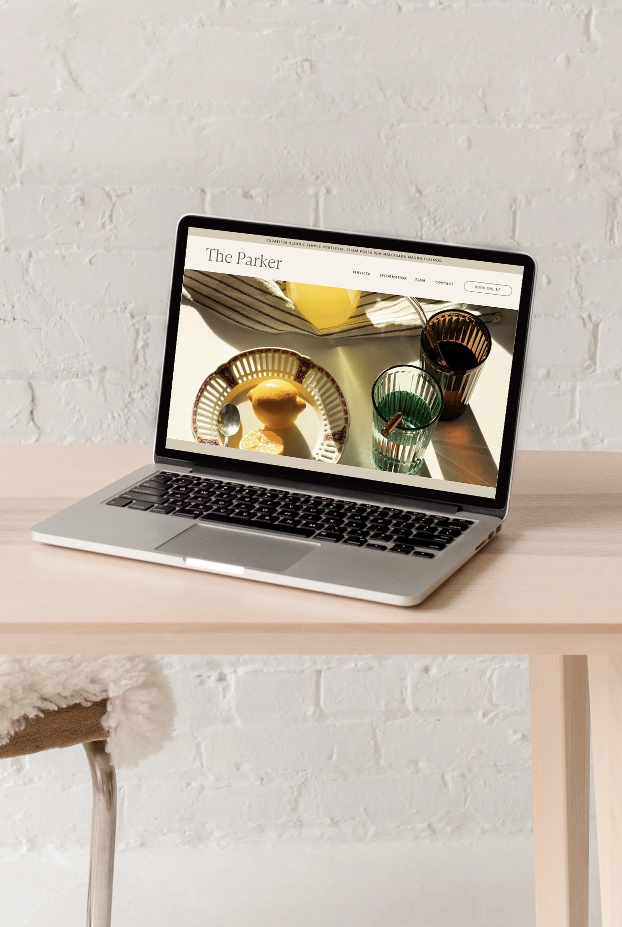 laptop displaying the hero section of The Parker website design
