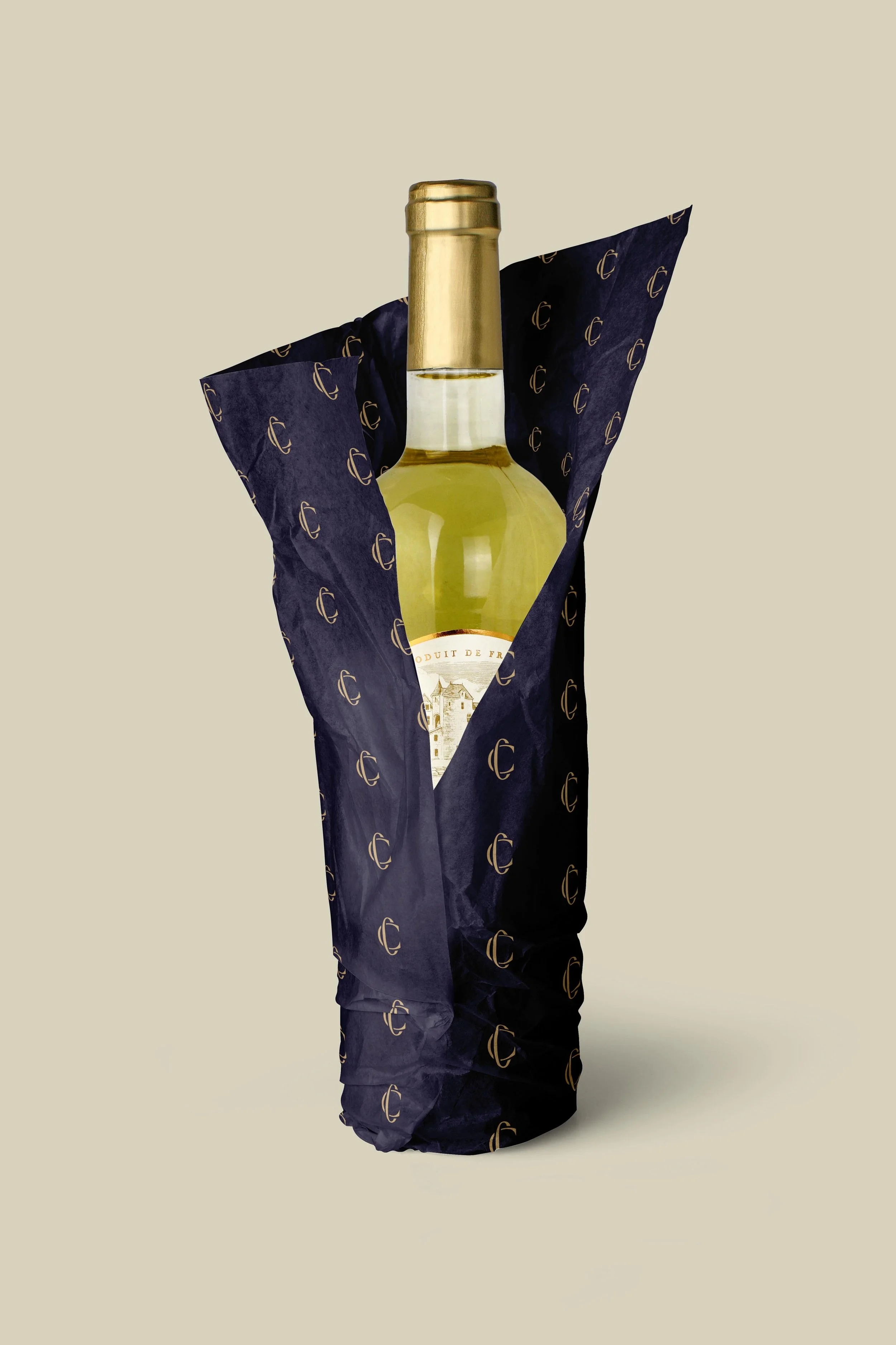 wine bottle wrapped in Cloutier & Co. branded tissue paper