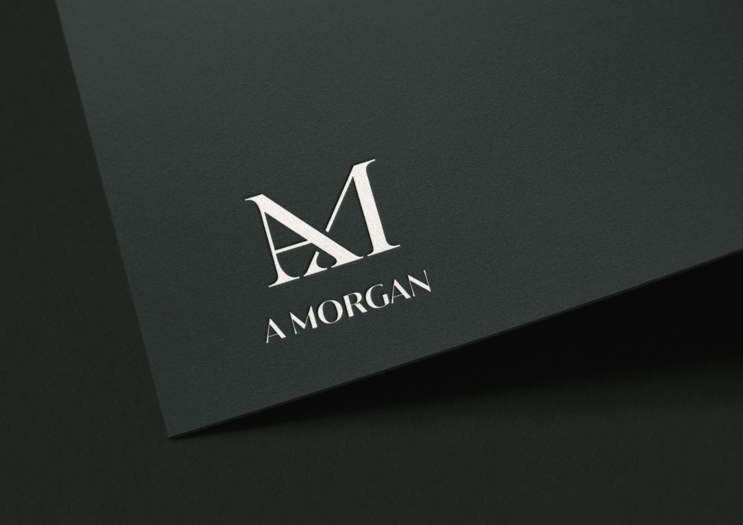 A Morgan Floral Design logo embossed on black cardstock