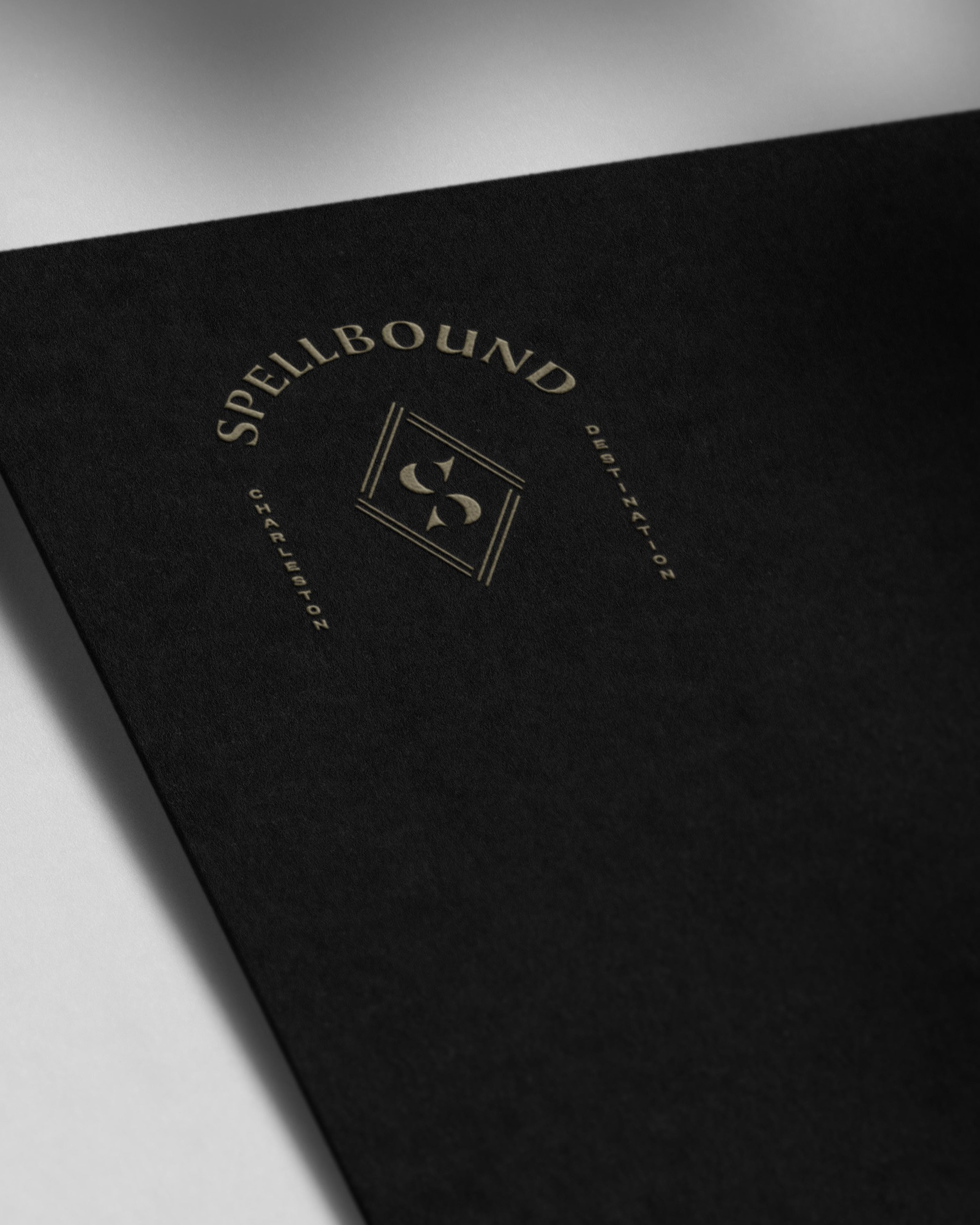 Spellbound Events logo design embossed on black card stock
