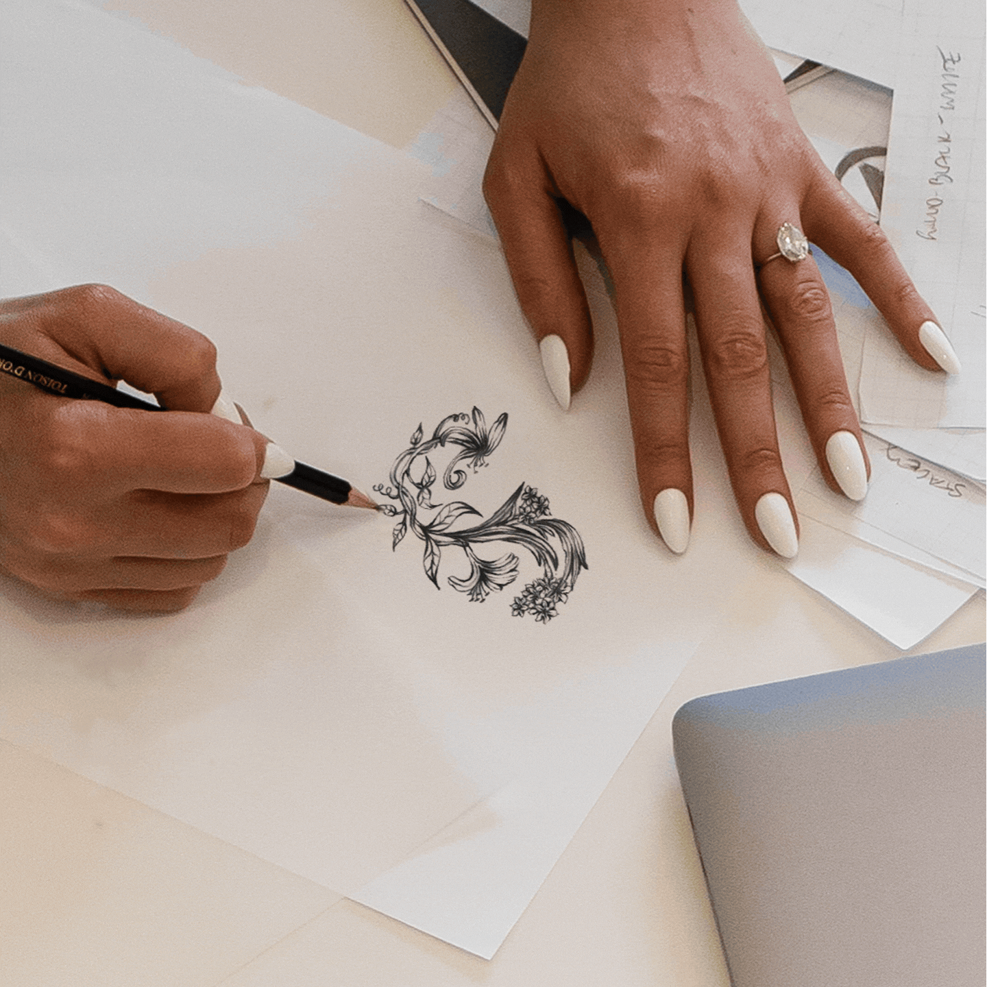 animation cycling through the stages of the custom branding process from sketch to vector to final printed logo design