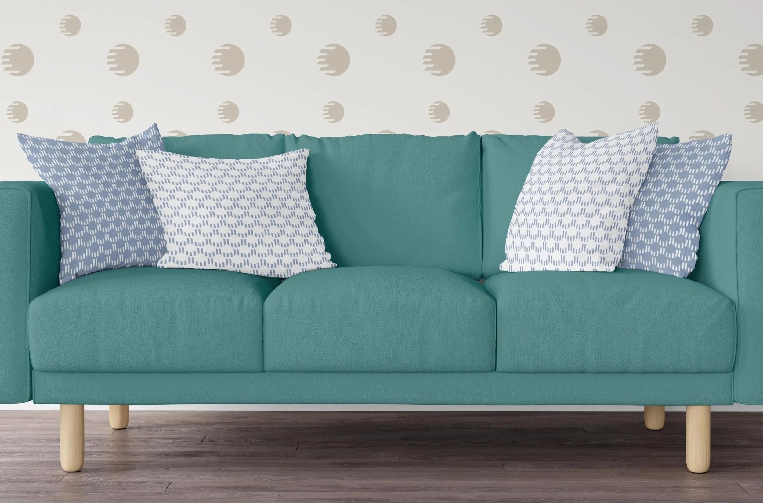 Couch with pillows and wallpaper that are printed with the City Step Podiatry brand patterns