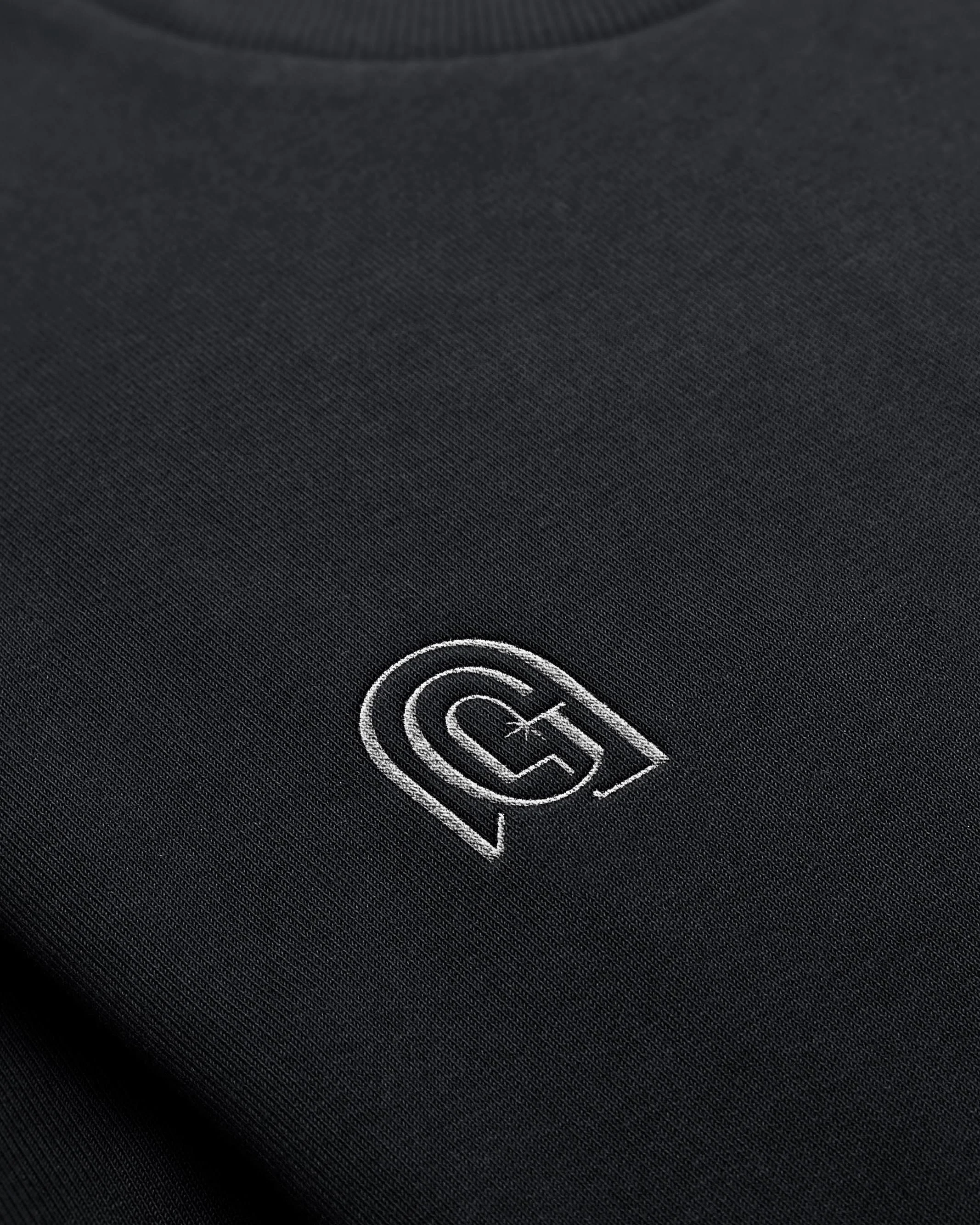 Genesis icon embroidered on apparel