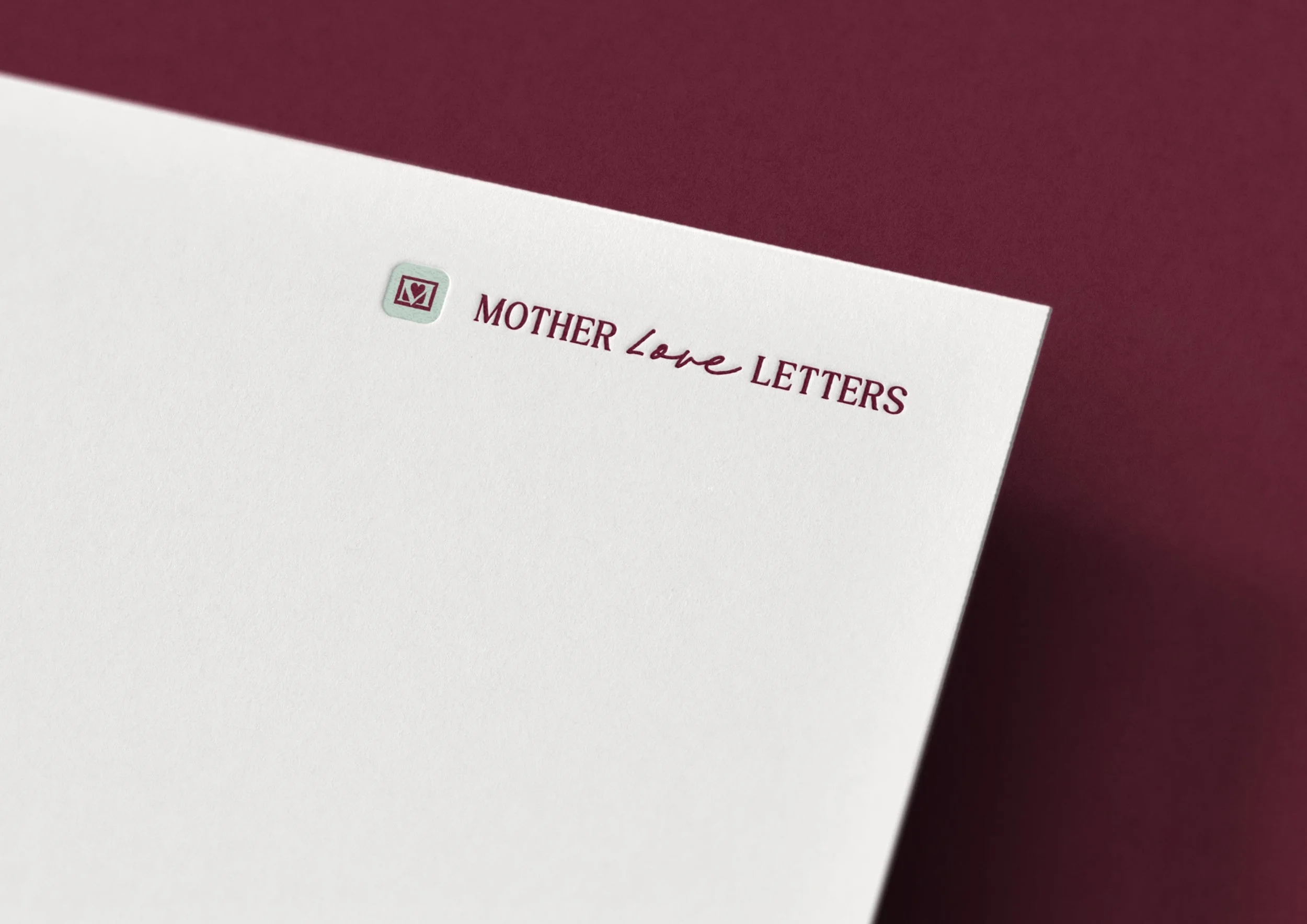 Mother Love Letters logo embossed on cardstock