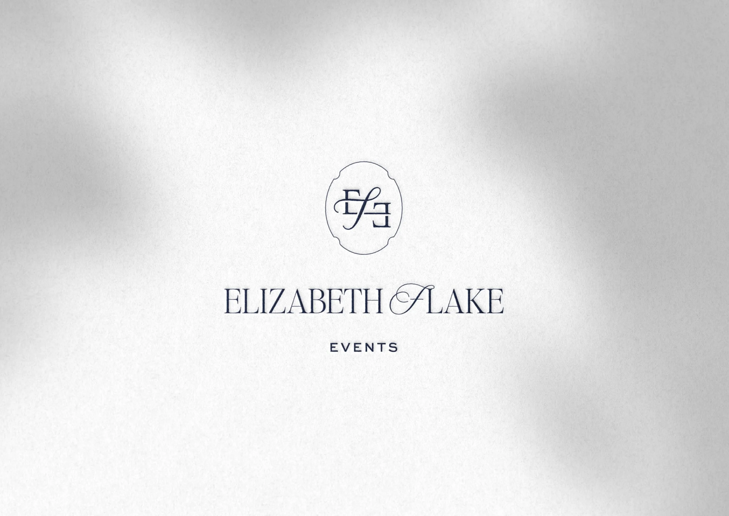Elizabeth Flake Events logo embossed on card stock