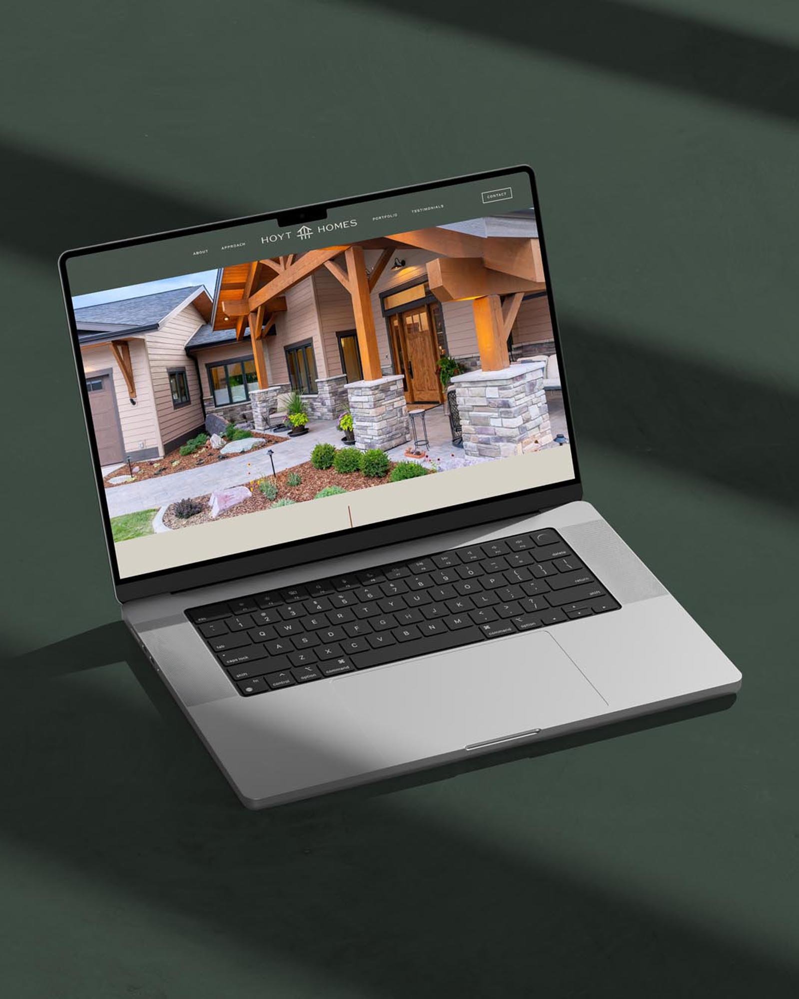 Hoyt Homes Construction Company website homepage design, mocked up on a laptop