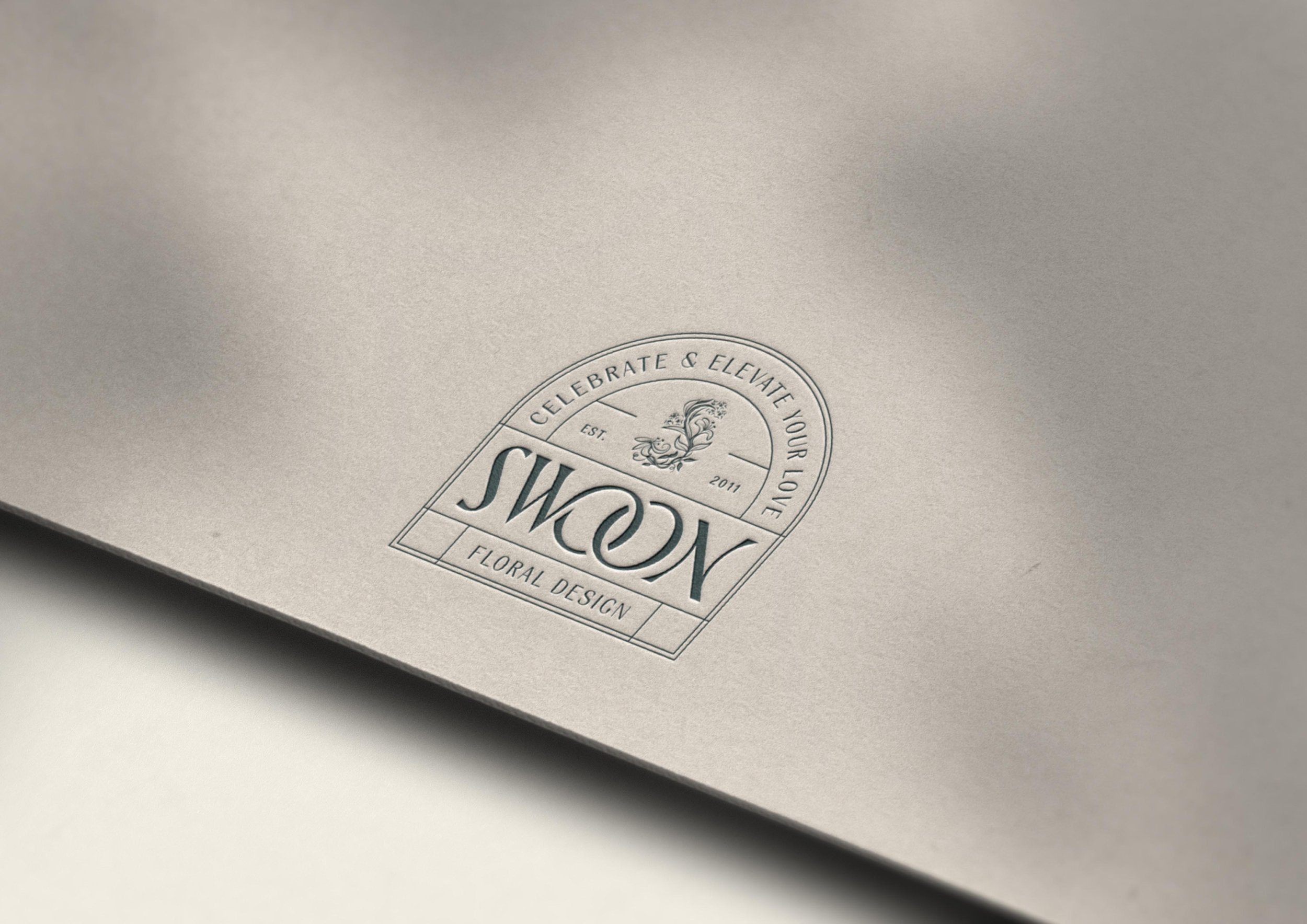 Swoon Floral Design logo embossed on cardstock