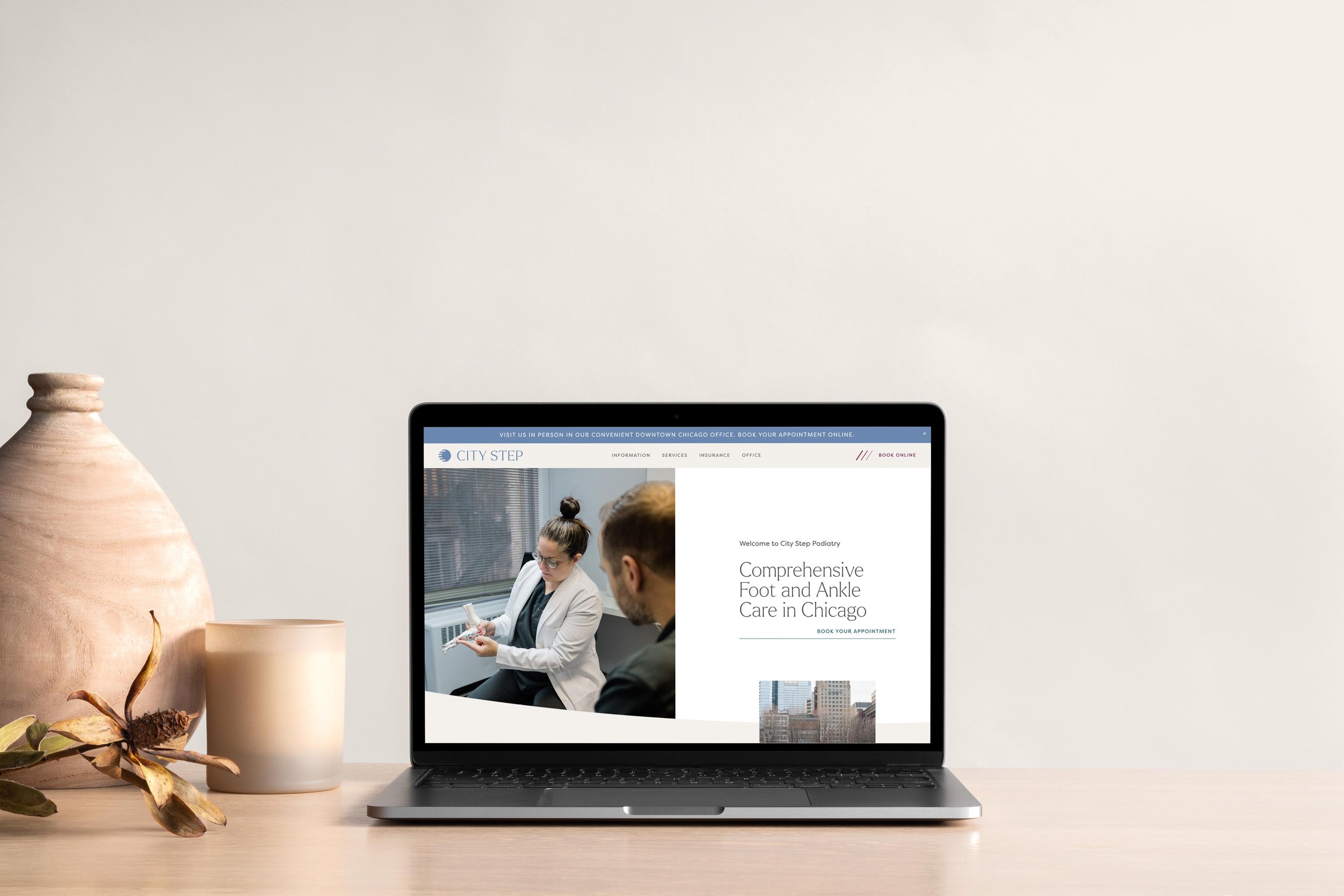 laptop displaying the City Step Podiatry website homepage hero section