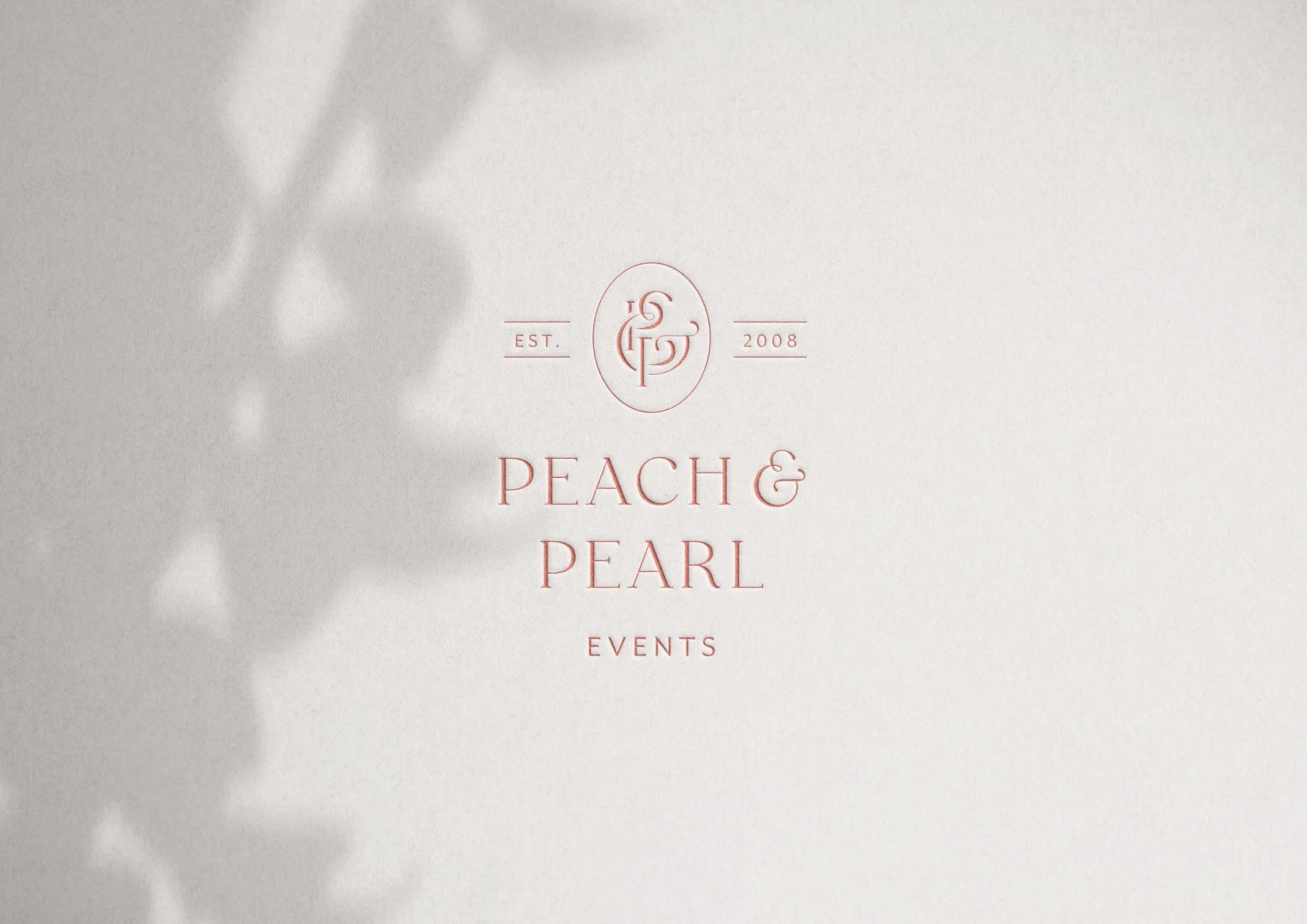 Peach & Pearl Events logo embossed on white card stock