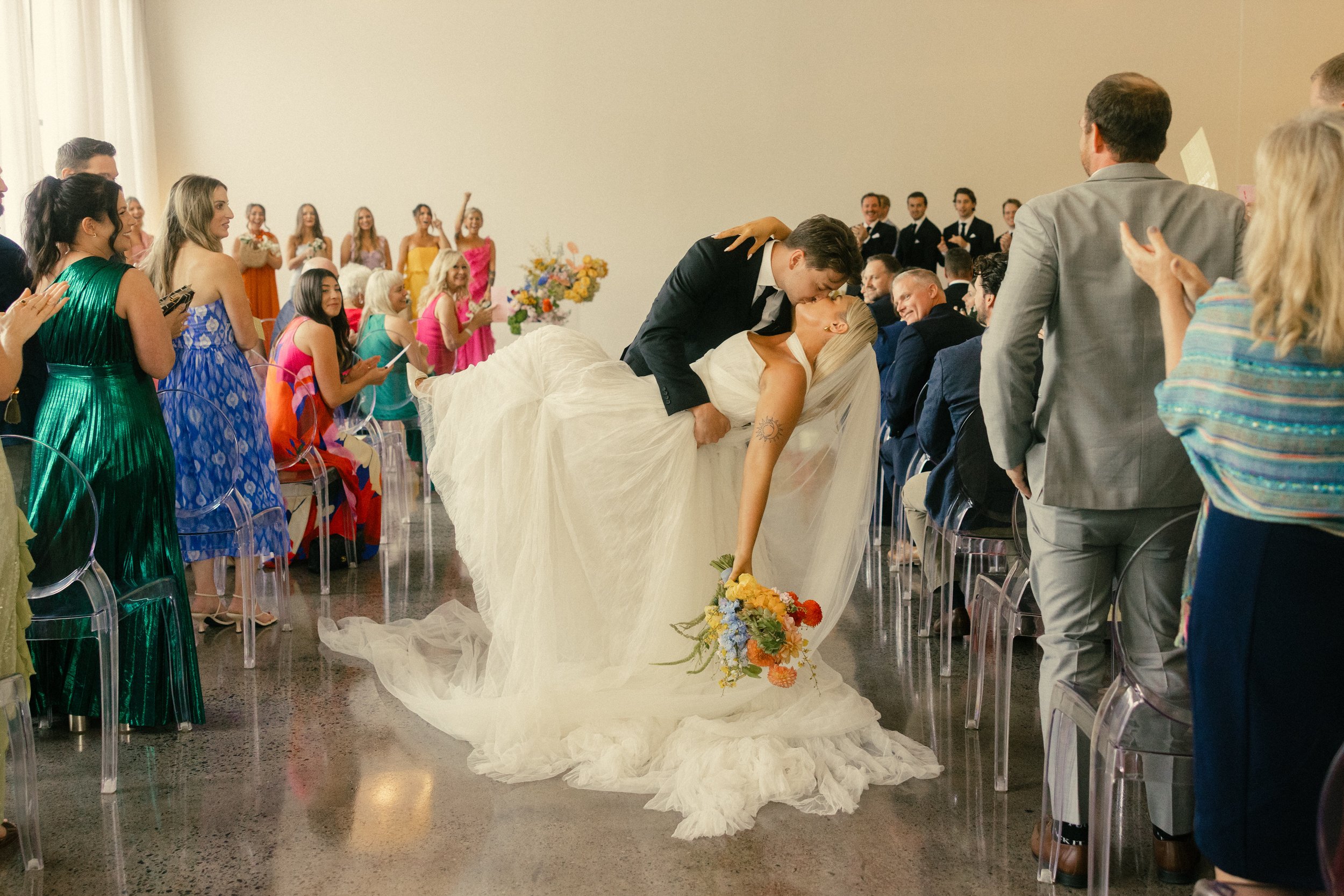 colorful-urban-daisy-wedding-ceremony-kiss-minneapolis.jpg