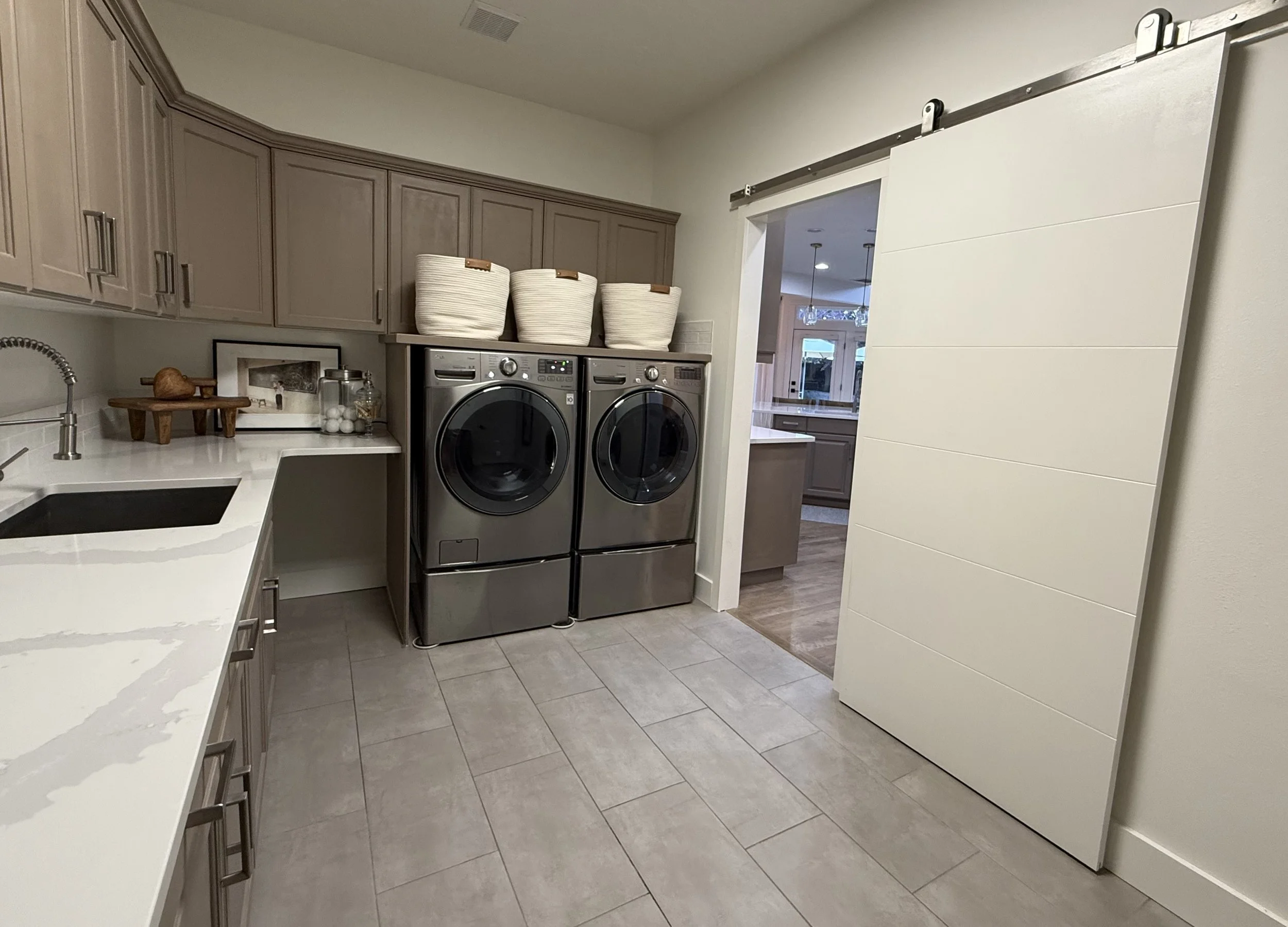 Massive Laundry Room with Utility Sink and Ample Storage
