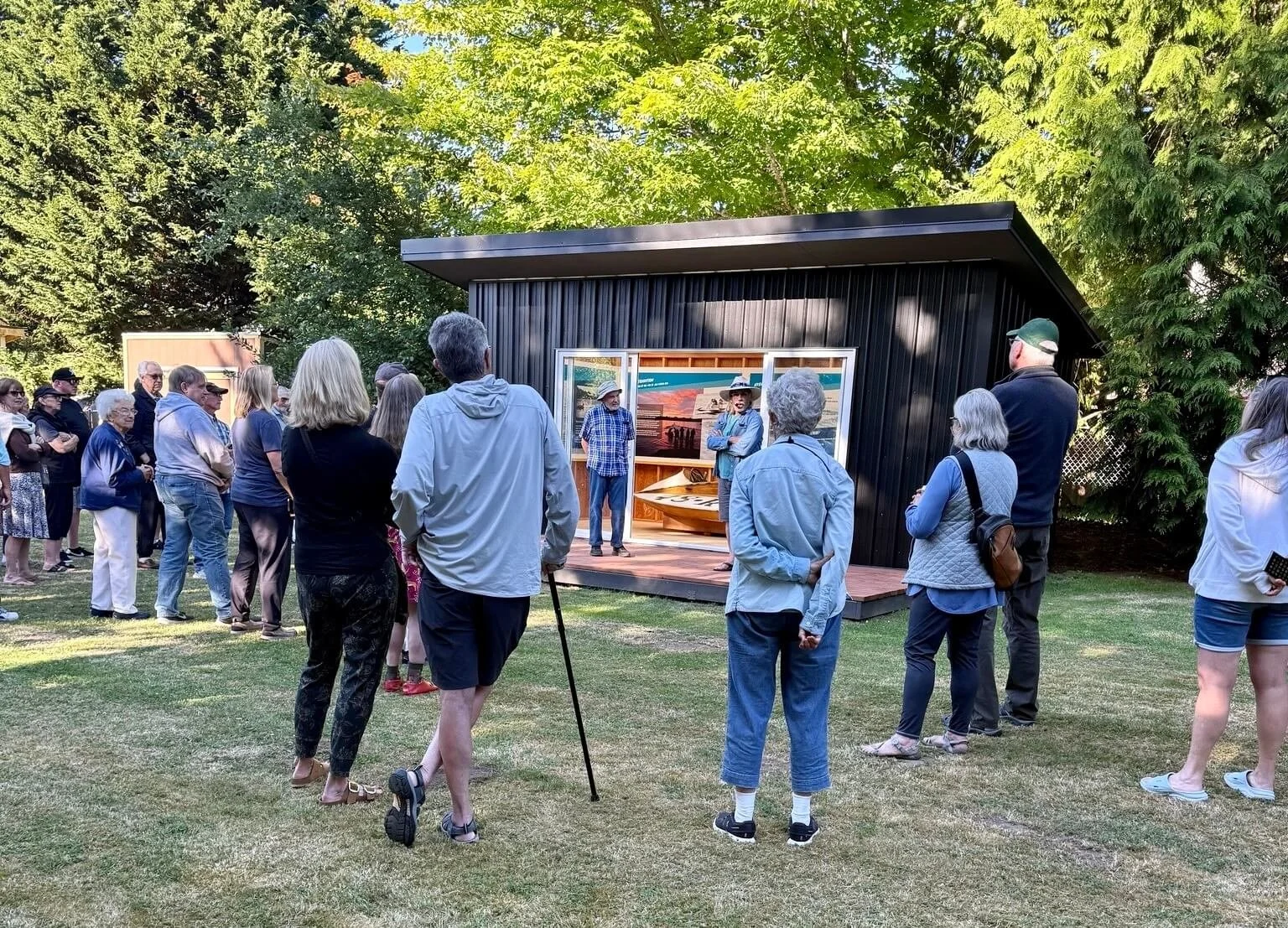 outdoor-gathering-of-people-at-boathouse-opening-vashon-heritage-musuem