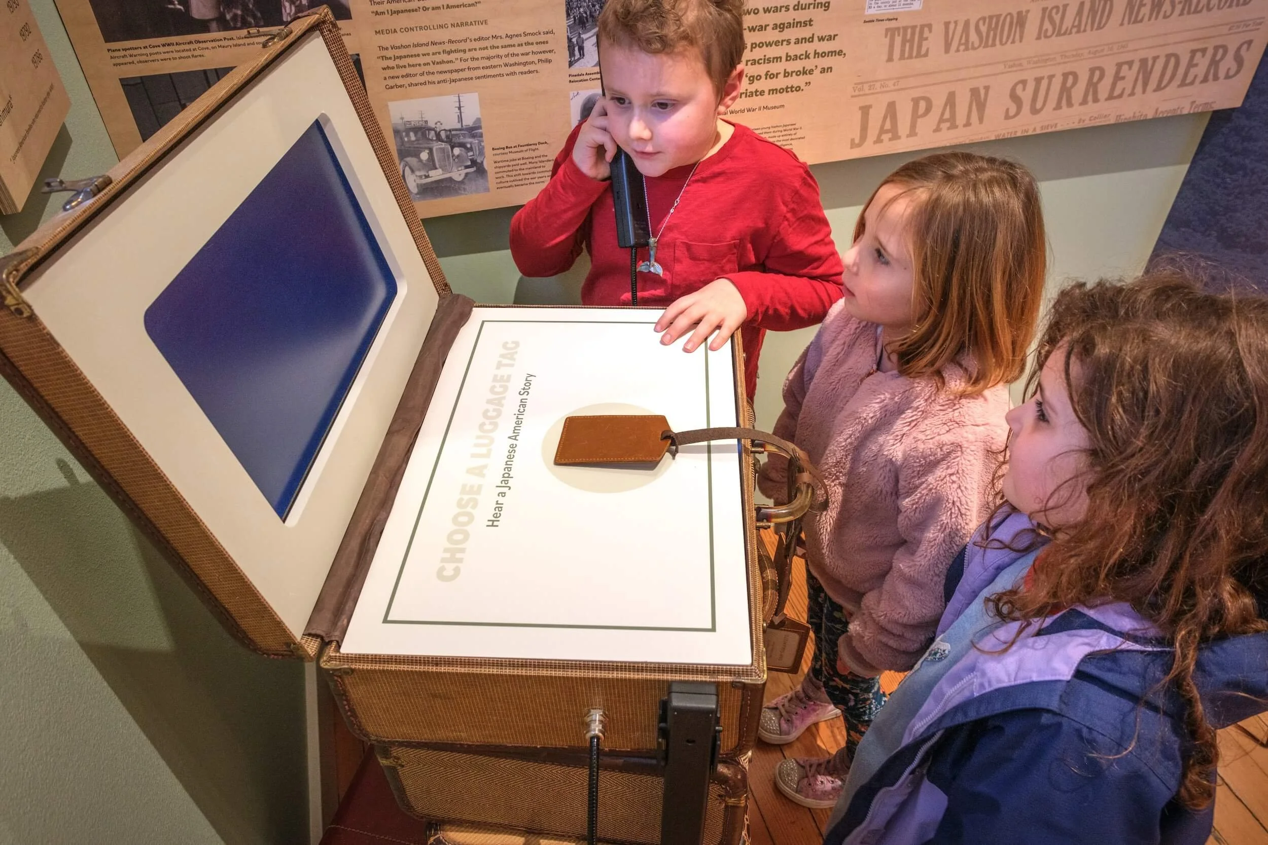 three-children-at-vintage-luggage-museum-display-vashon-heritage-museum