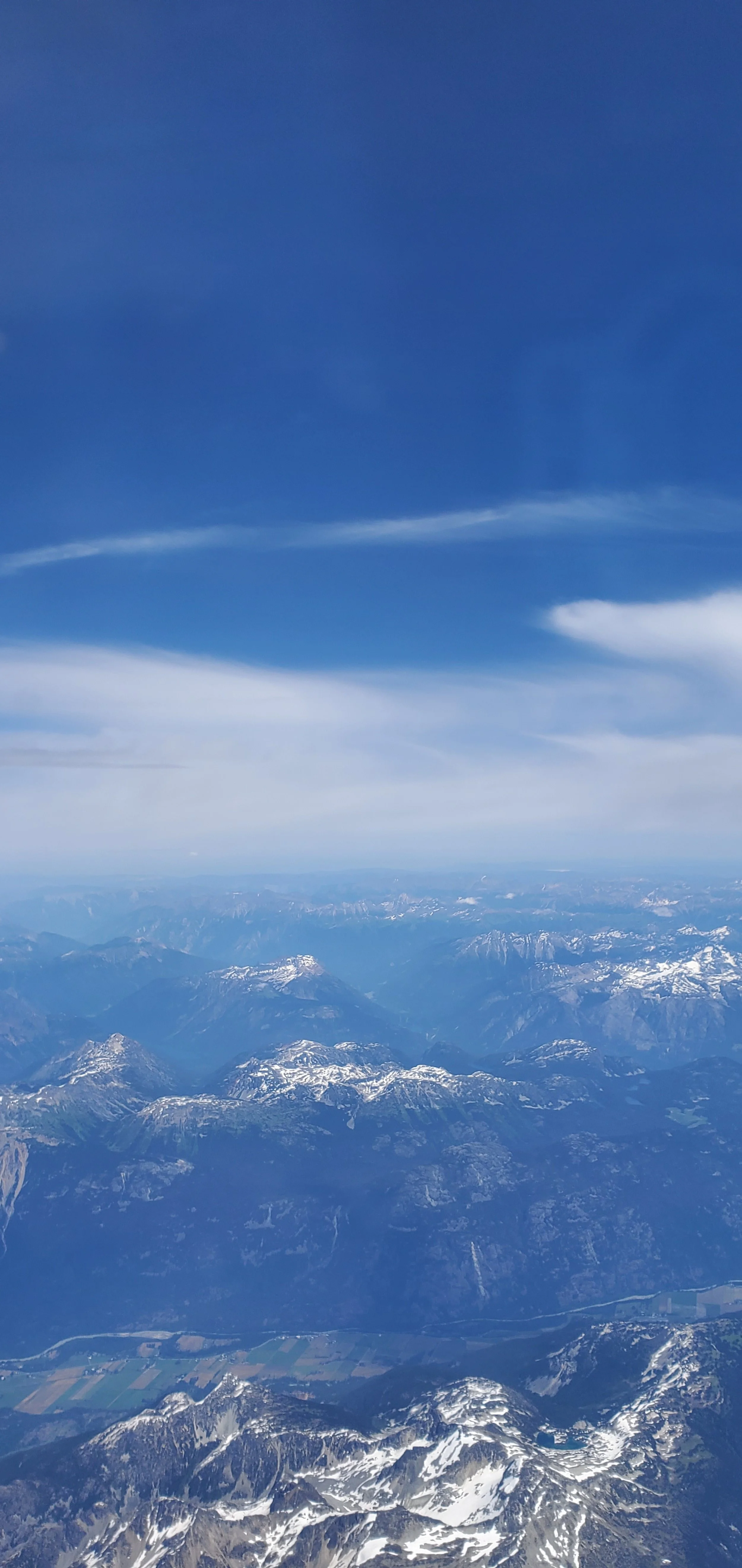 a view of mountains from an airplane