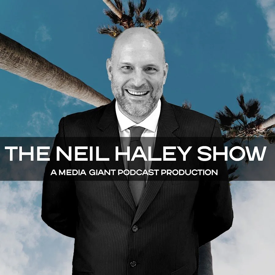 A man in a suit smiling in front of palm trees and a blue sky, with text overlay that says "The Neil Haley Show: A Media Giant Podcast Production".