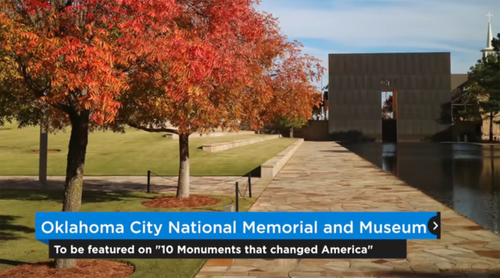 View of Oklahoma City National Memorial and Museum with colorful fall trees and a water feature in front.