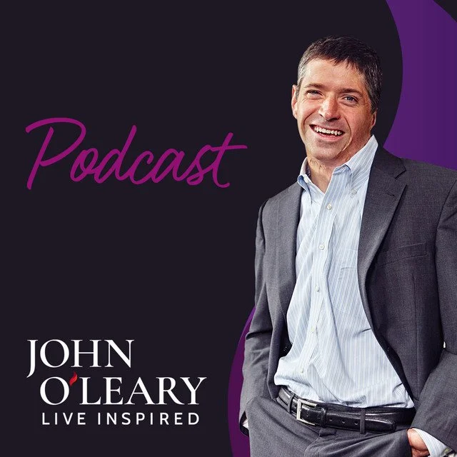 Promotional graphic for a podcast featuring John O'Leary, with a photo of him smiling in a gray suit and light blue shirt, against a dark and purple background, with the words "Podcast" and "Live Inspired".