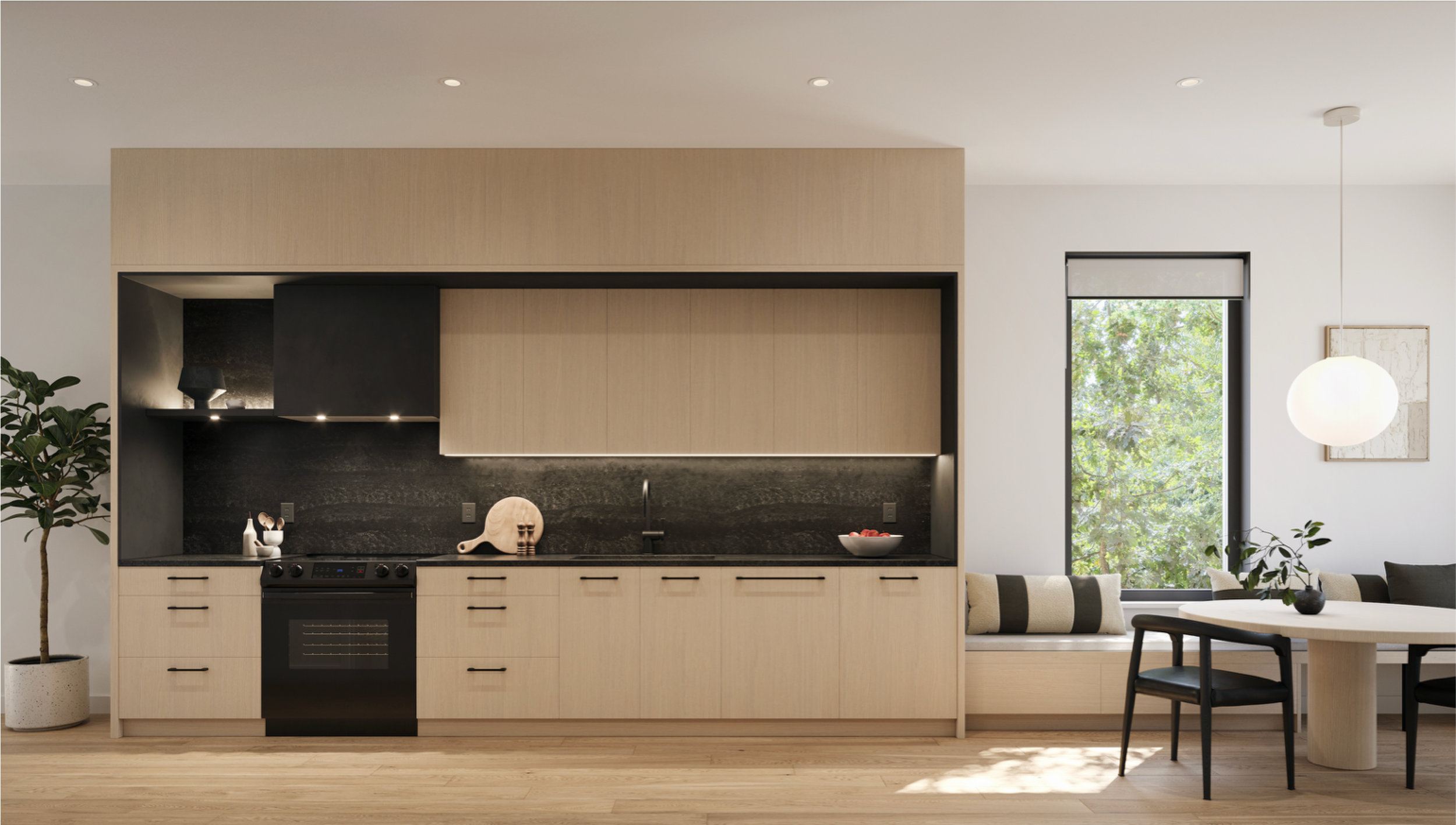 Modern kitchen with light wood cabinets, black countertop and backsplash, built-in oven, black range hood, and a window seat with striped cushions next to a dining area with a table and chairs, illuminated by natural light and a hanging pendant light.