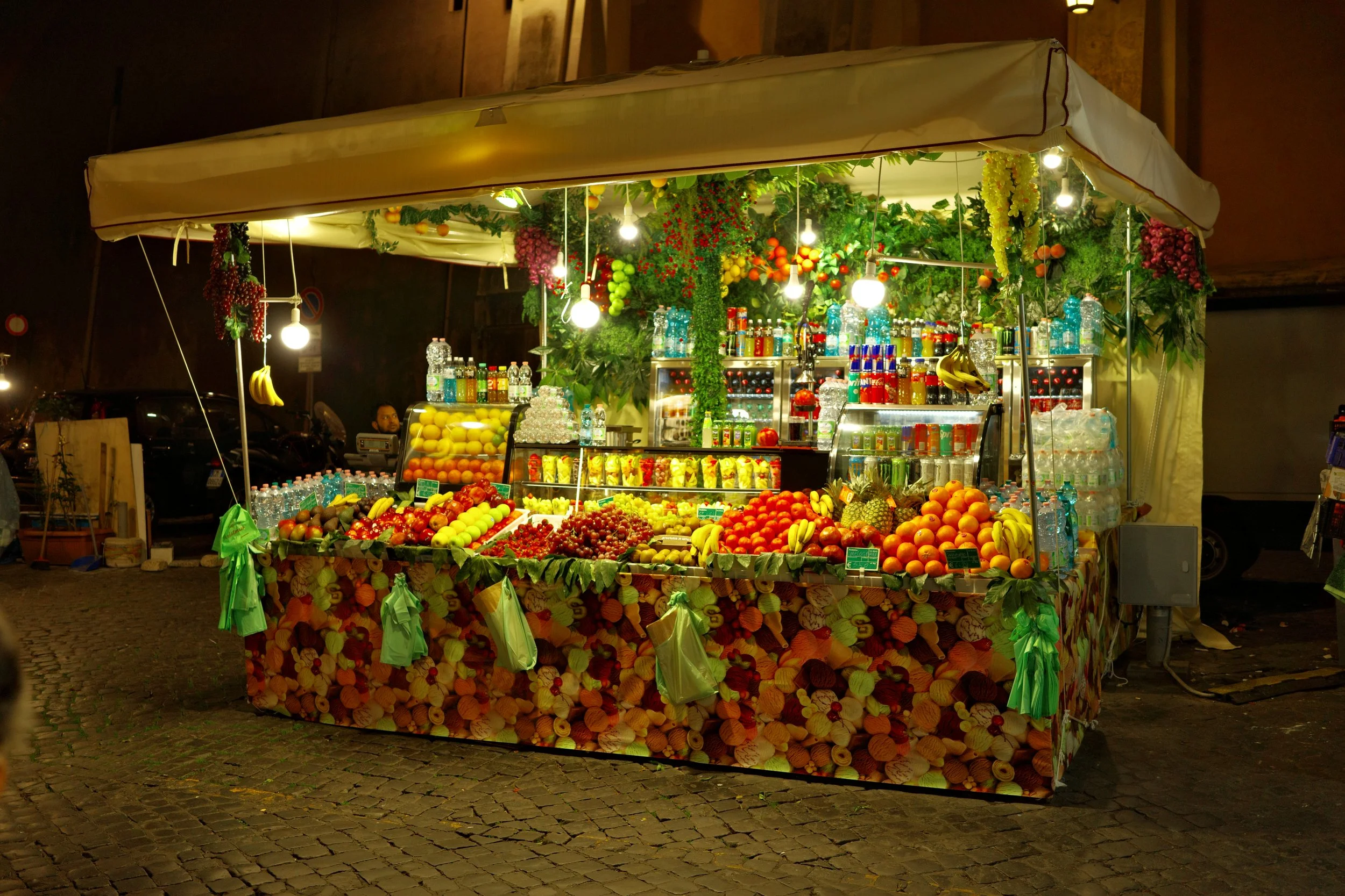 Near Trevi, where fruits glow brighter than the lights.