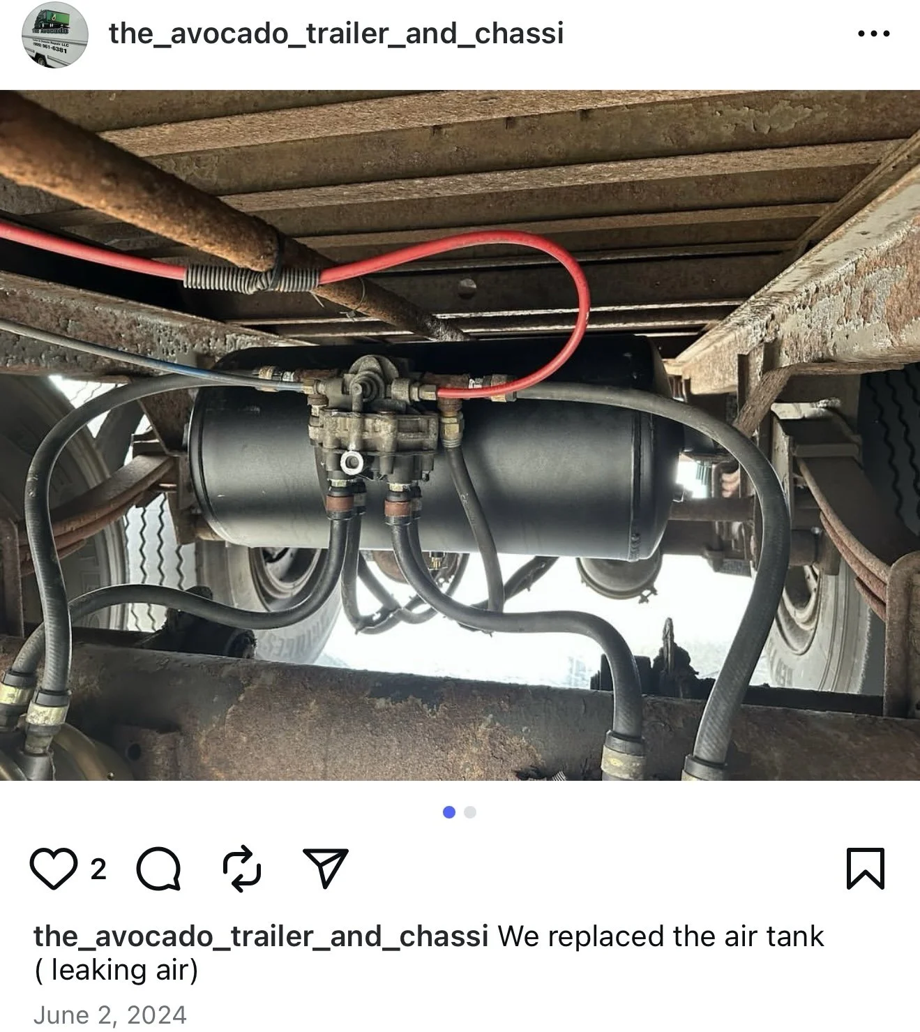Underneath a trailer chassis, an air tank is shown with hoses connected to it, and the description indicates that the air tank was replaced due to leaking air.