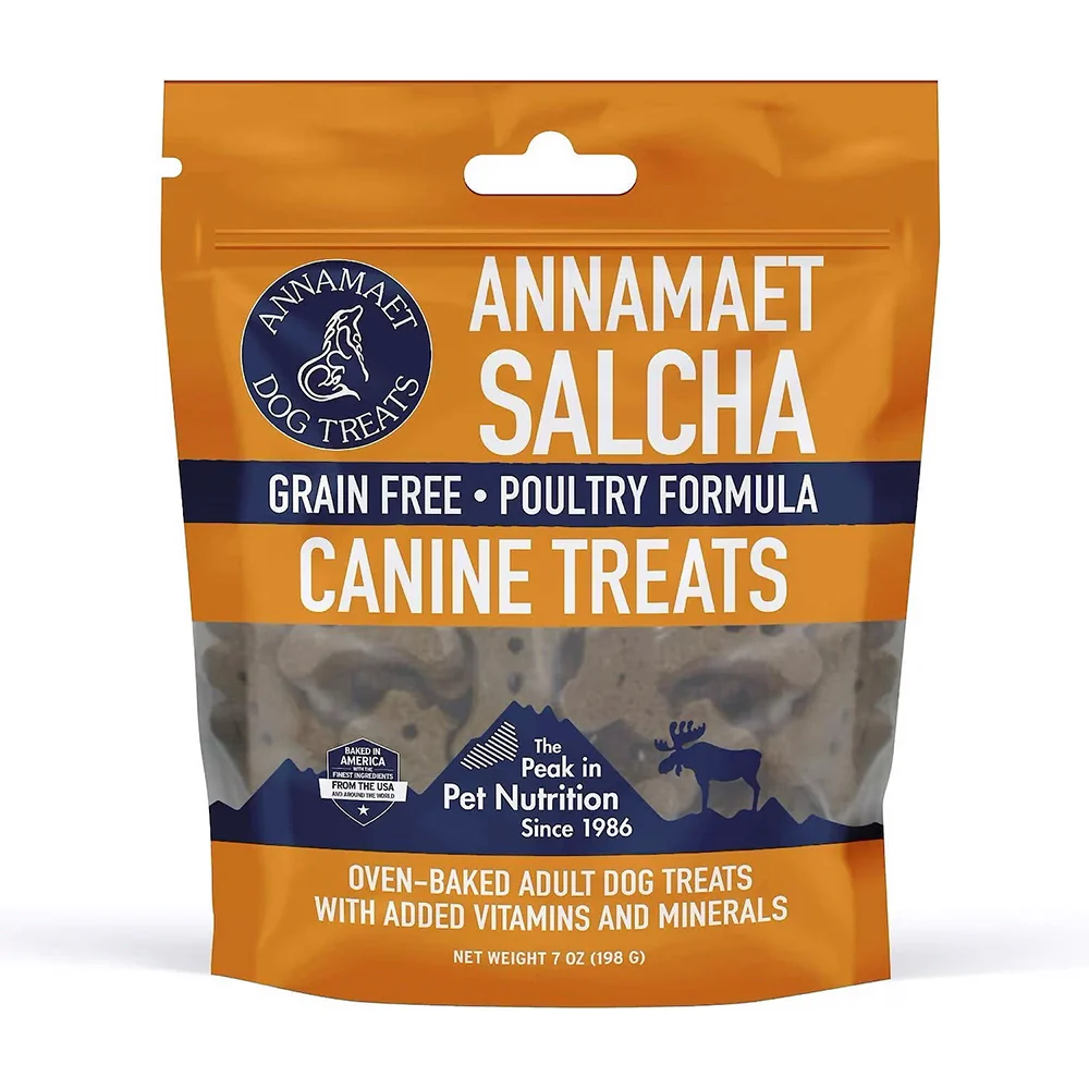Gold and navy blue package of Annamaet Salcha grain-free dog treats with images of a mountain and a moose, labeled as oven-baked adult dog treats with added vitamins and minerals.
