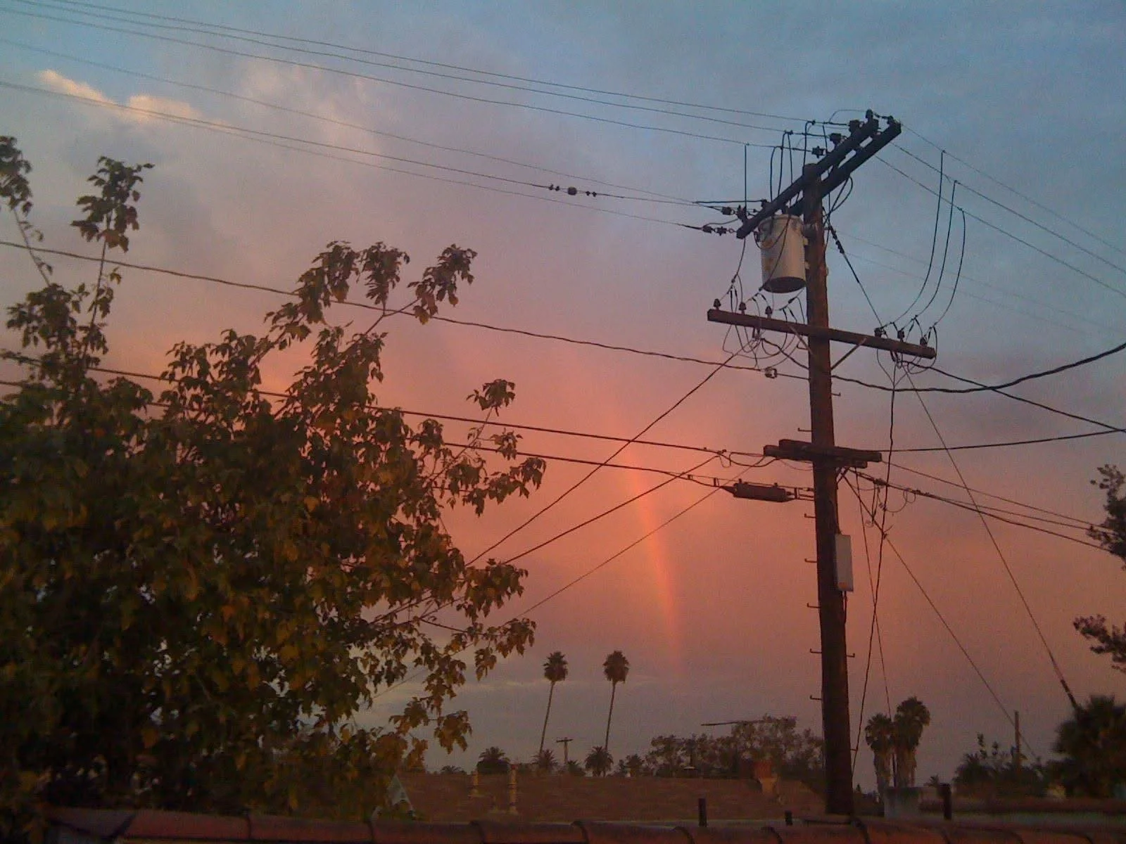 A picture of a rainbow above Eva Luna Ortiz's childhood home taken the day of her mother Laura Salwet's death. Picture taken by Eva's aunt Melinda Salwet on September 4th, 2011 in mid-city Los Angeles.