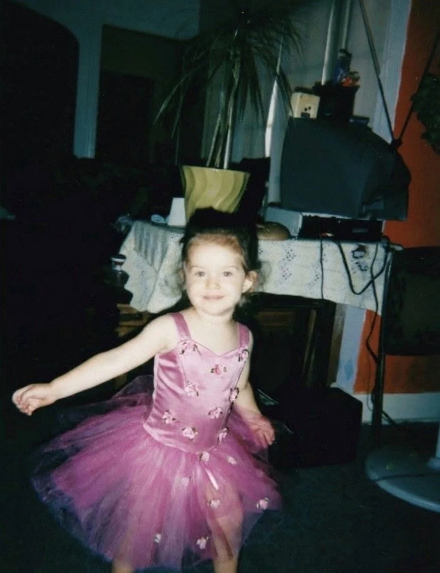 2 year old Eva Luna Ortiz twirls in a pink ballerina tutu in her living room expressing freedom and joy.