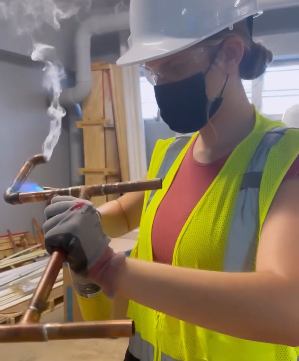 Eva Luna Ortiz soldering a copper pipe in 2022