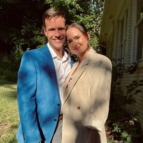 Bride and groom from the Doss wedding smiling together outdoors after their Savannah celebration.