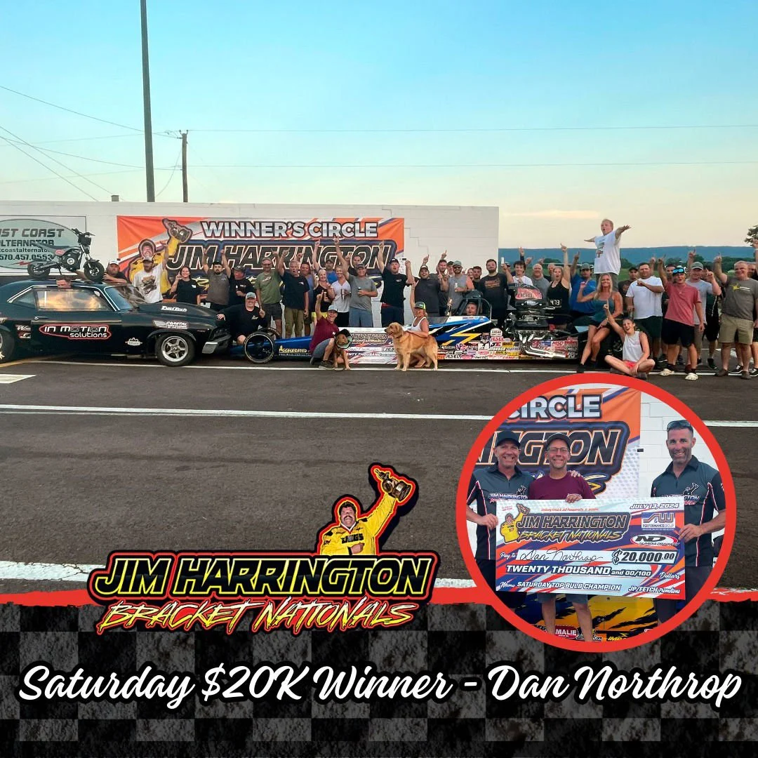 Group of people celebrating around drag racing cars on a racetrack after winning a race, with a large orange banner reading 'Winner's Circle Jim Harrington' in the background. Inset shows three men holding a large $20,000 check, with one of them hold