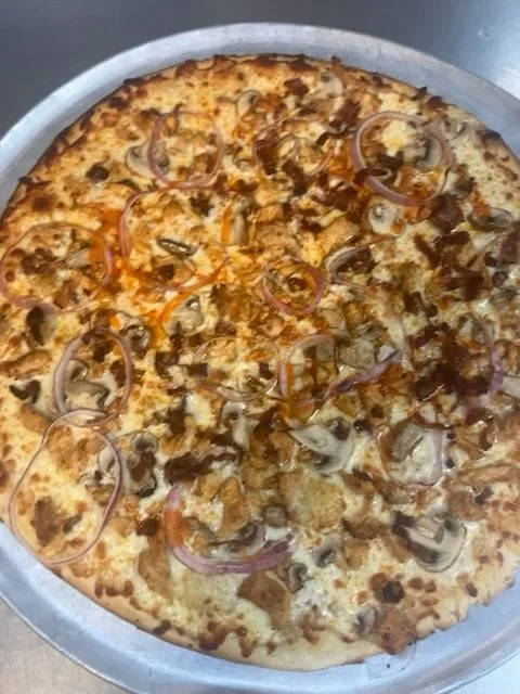 Meat lovers and onion pizza