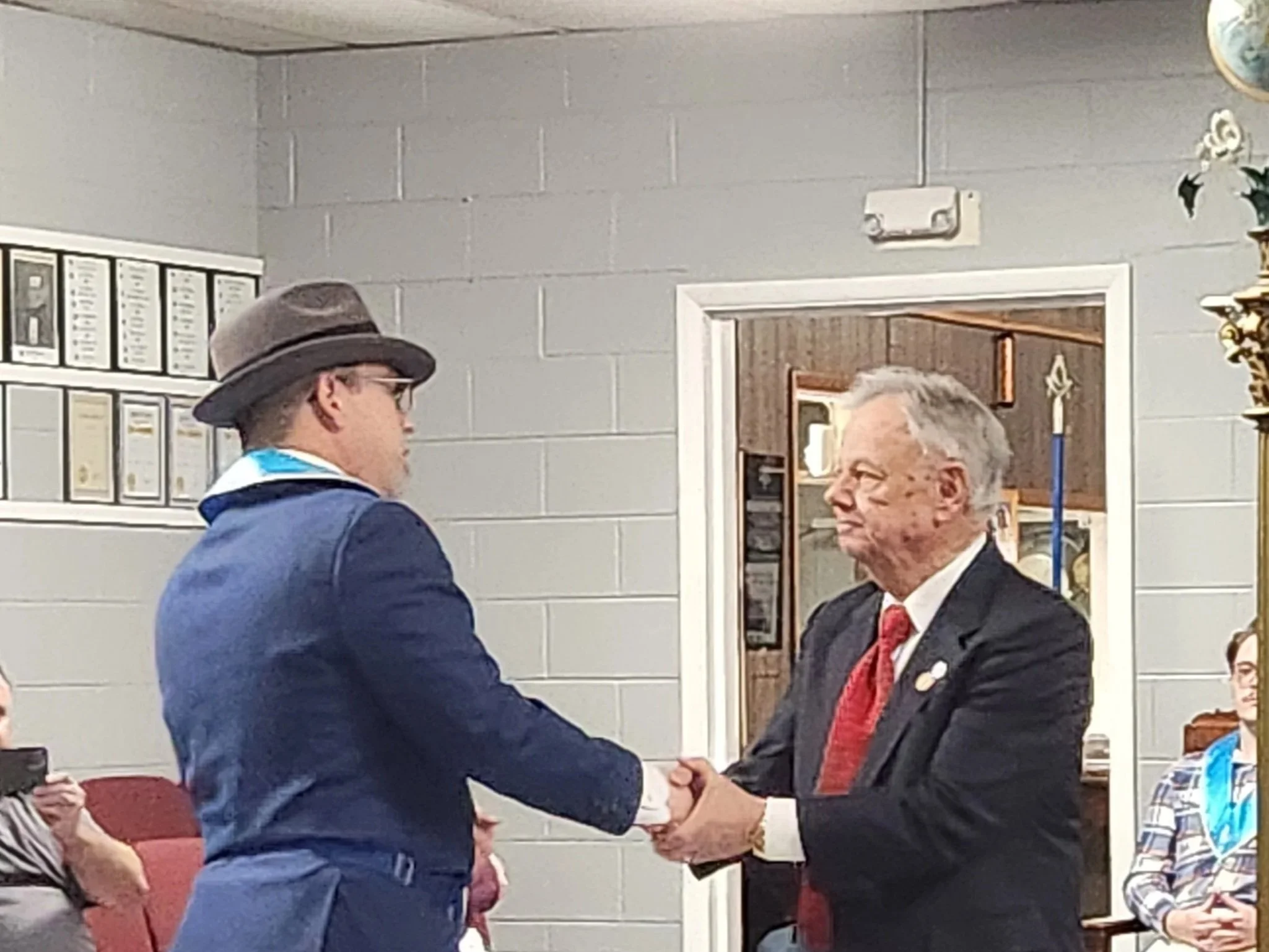 Worshipful Master Gerock presents his father, Bro James Gerock with his 50 year pin