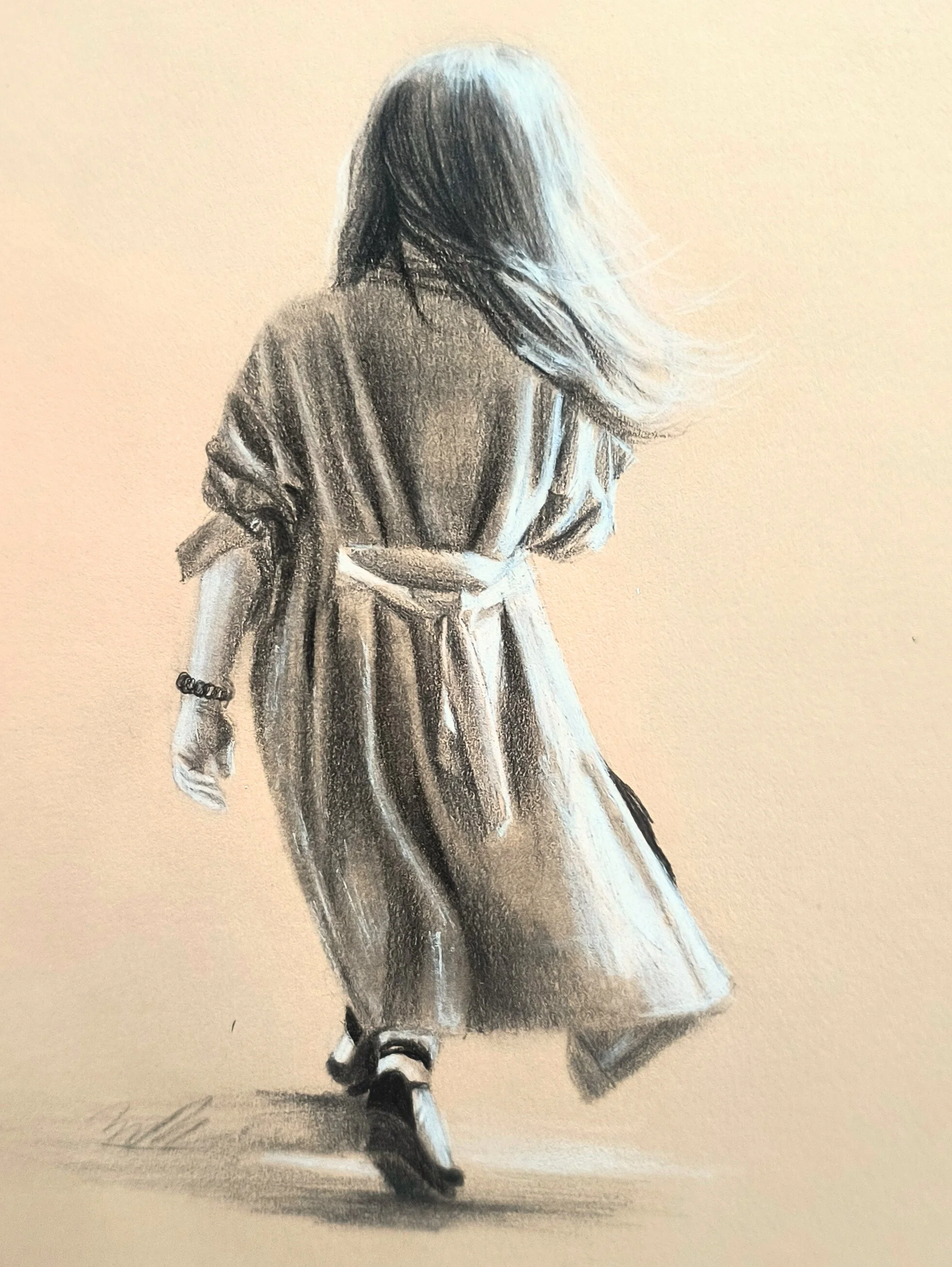 A woman in a long coat and heels walking away, with her hair blowing to one side.