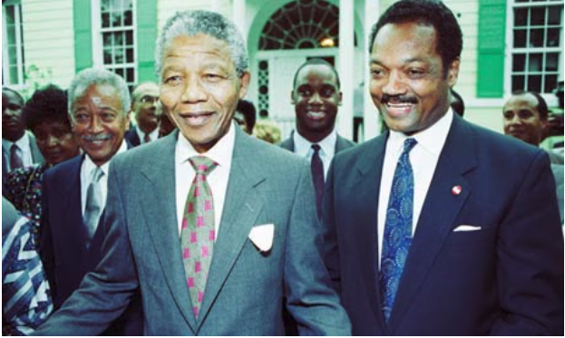 Nelson Mandela and Rev. Jesse Jackson at a reception in London, April 1990, weeks after Mandela's release from prison