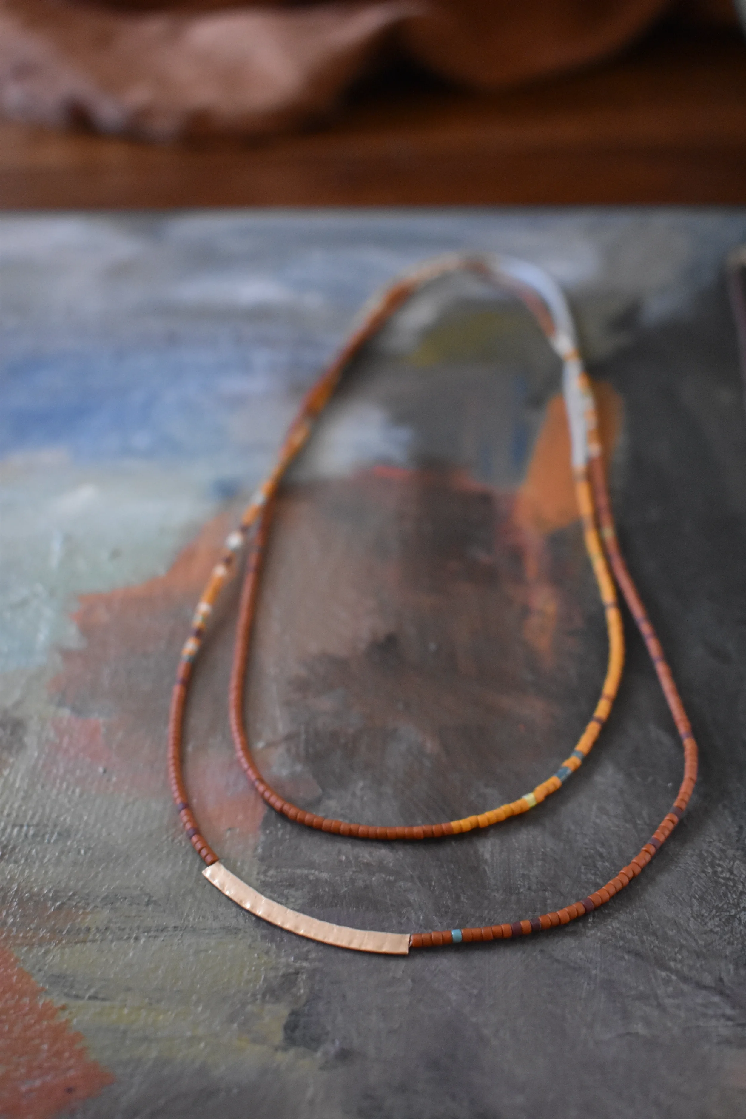Orange tones sand halo necklace.webp
