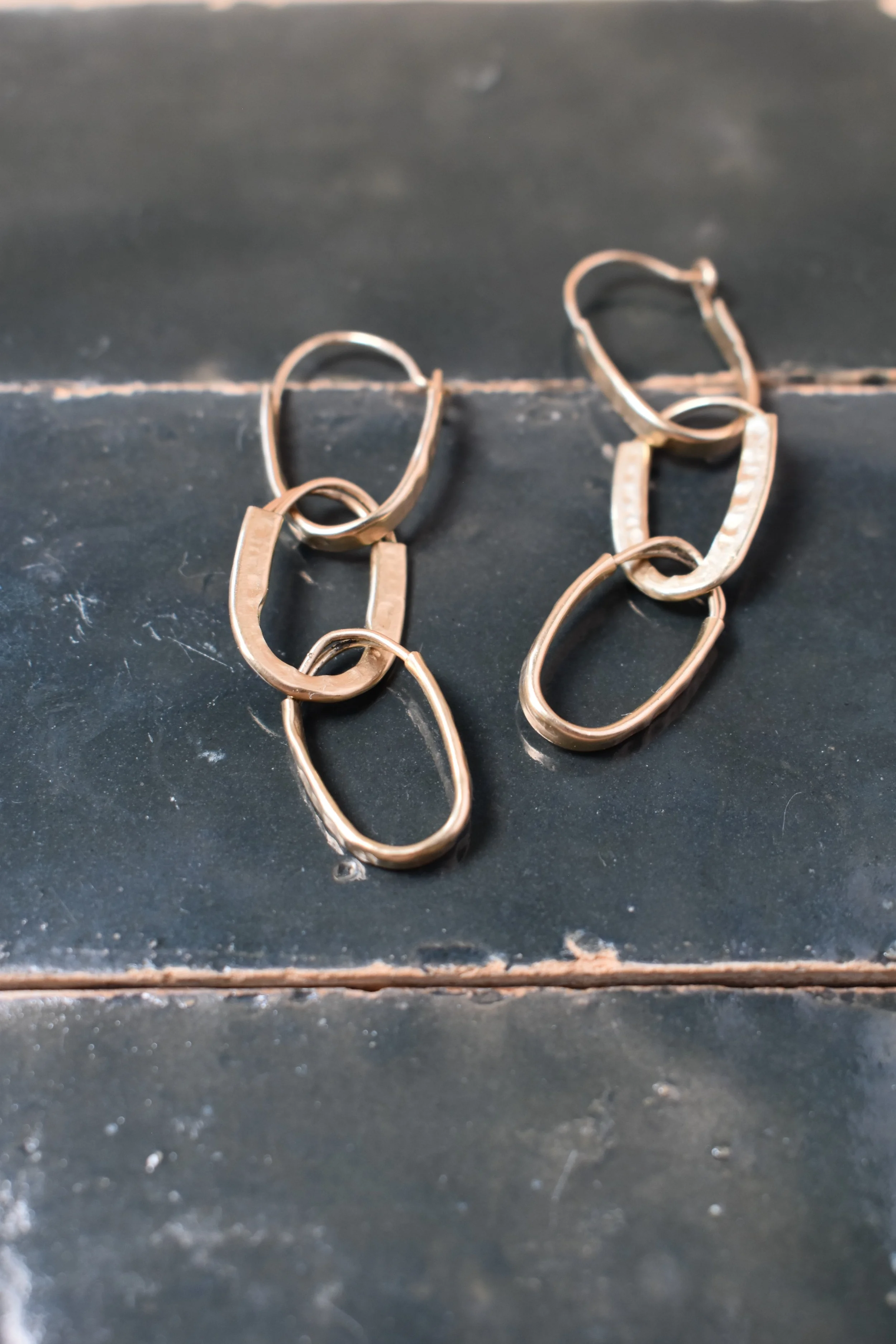 Hammered gold hoops 3 set flat lay.webp