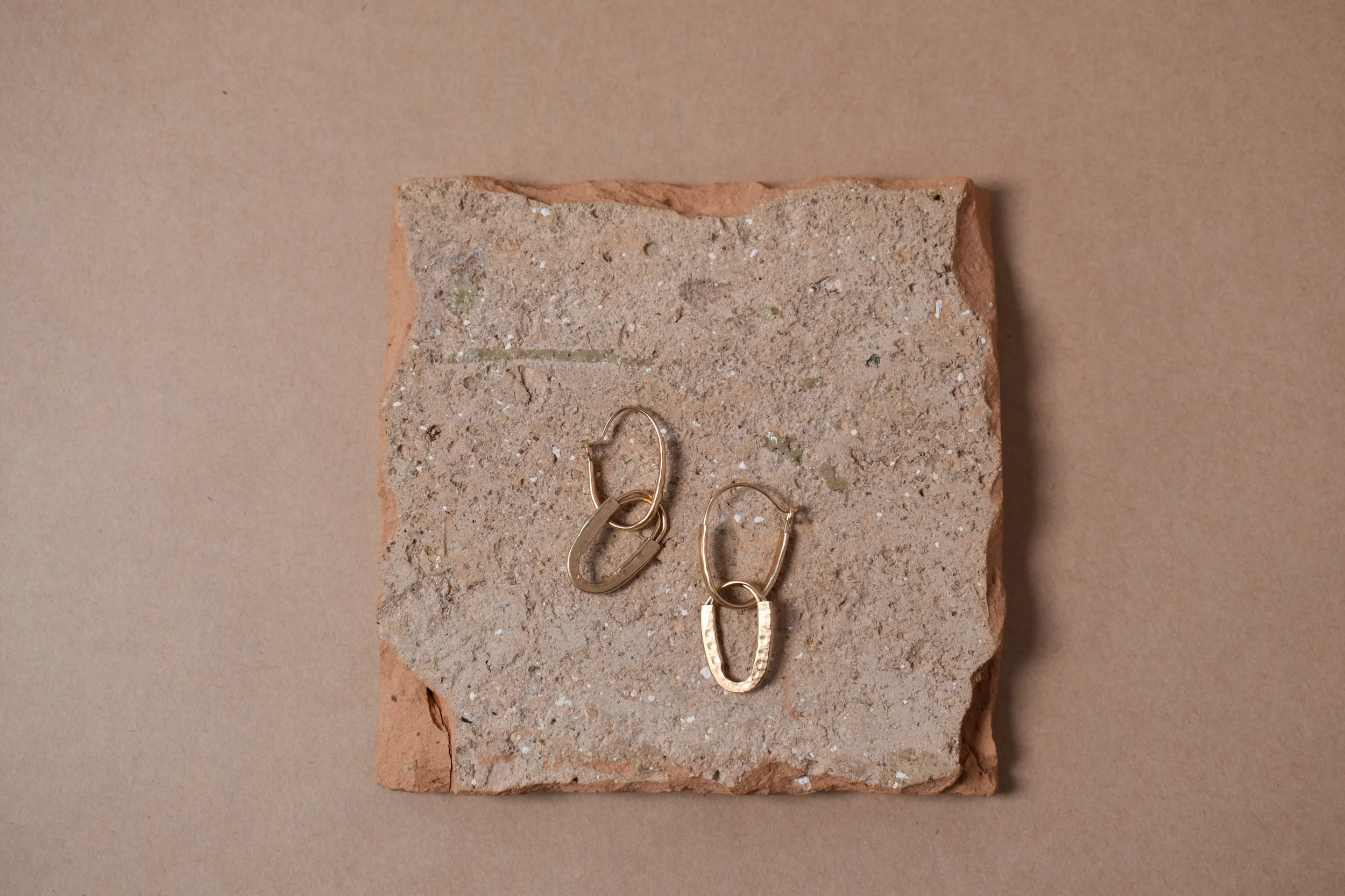 Hammered gold hoops 2 set flat lay clay horizontal.webp