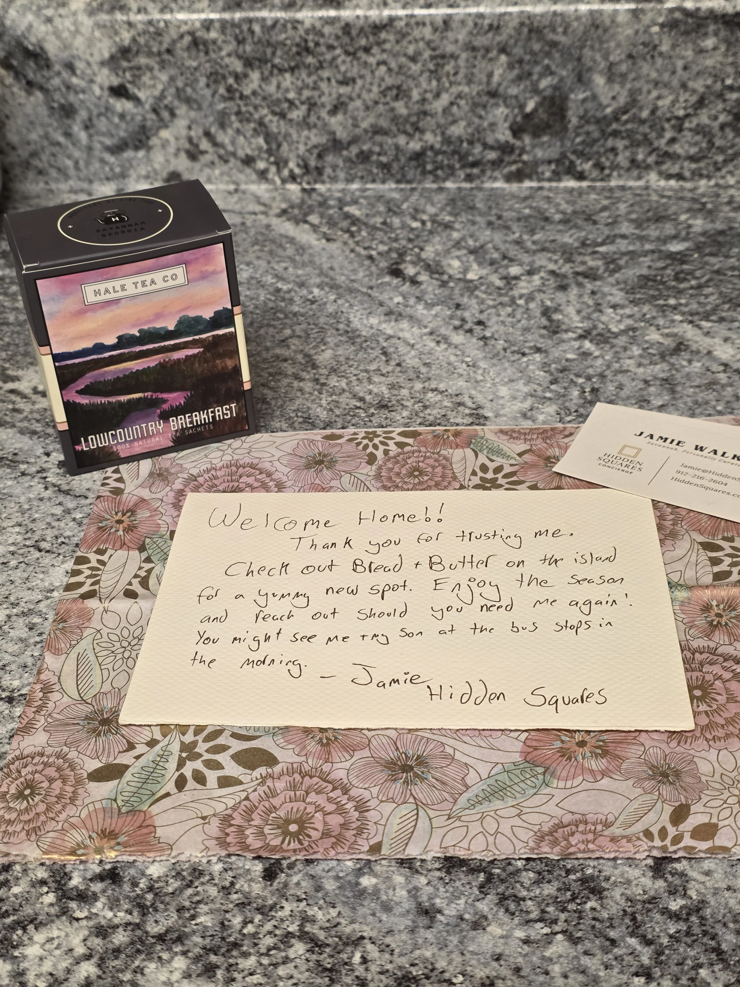 a welcome home note and a tea box from hale tea on a counter