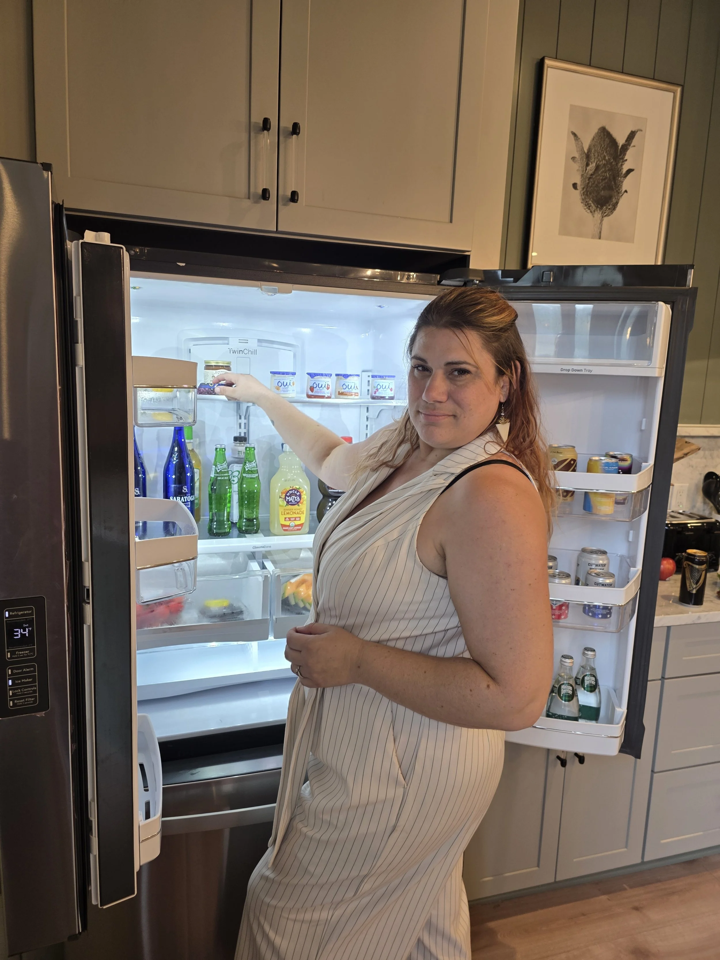 Jamie Stocking a fridge for a guest arrival