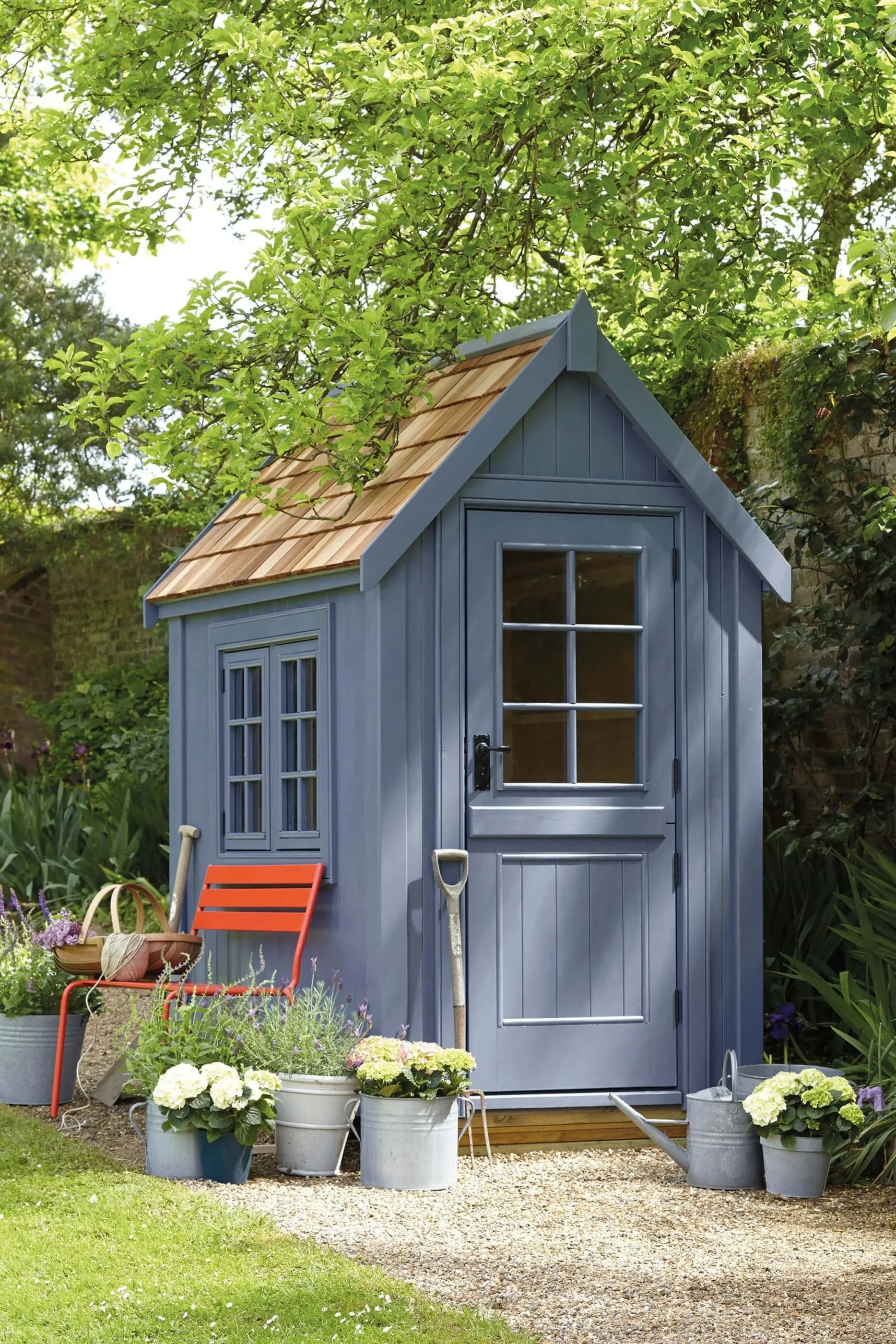 Little Greene Intelligent Exterior Eggshell paint on garden shed and woodwork in blue-grey, available at Heritage Home Supply Chicago