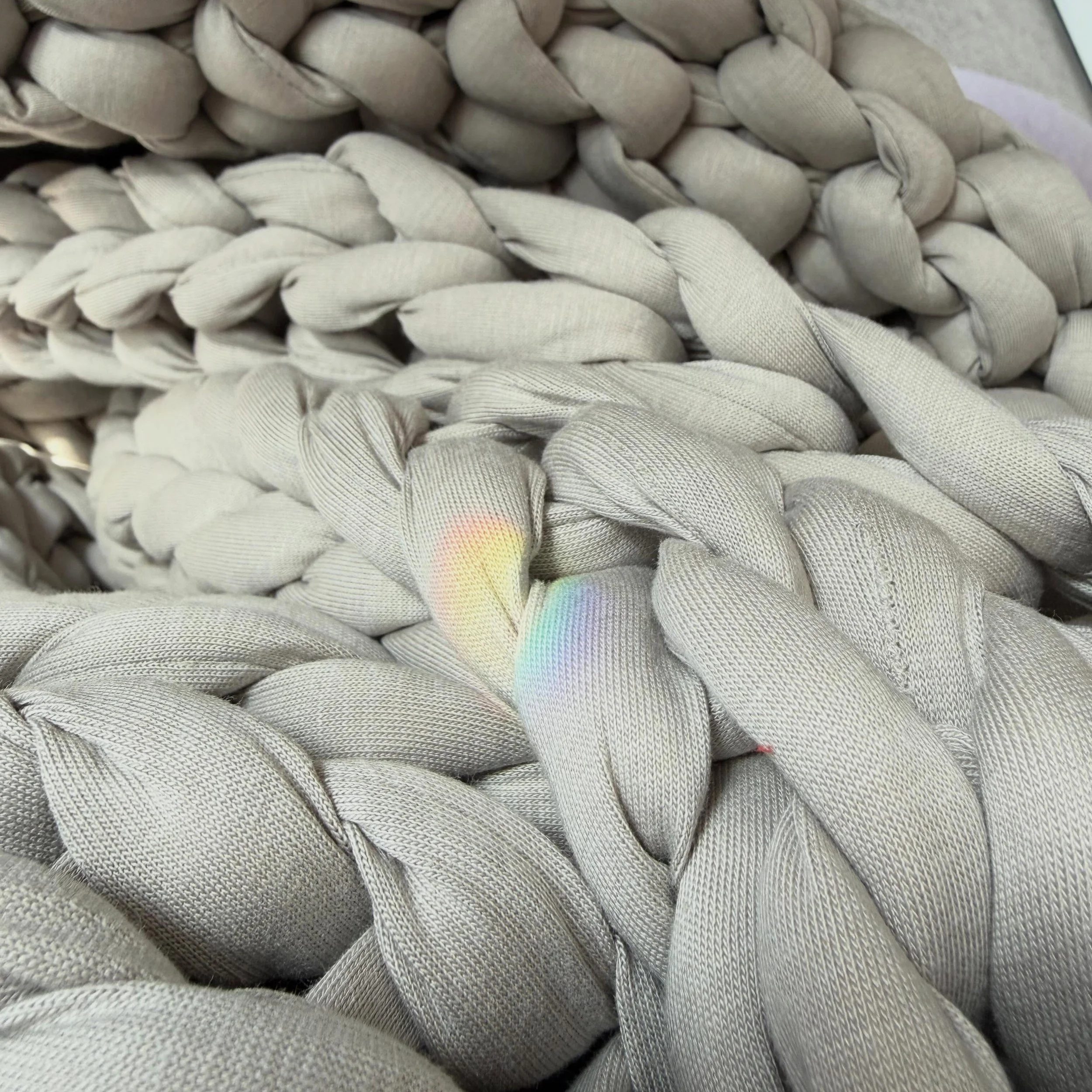 There&rsquo;s a prism on my weighted blanket.

Just a quiet spill of color&mdash;unexpected, uninvited, completely perfect&mdash;stretching itself across the soft heaviness I keep nearby for grounding. Red into violet into something that doesn&rsquo;